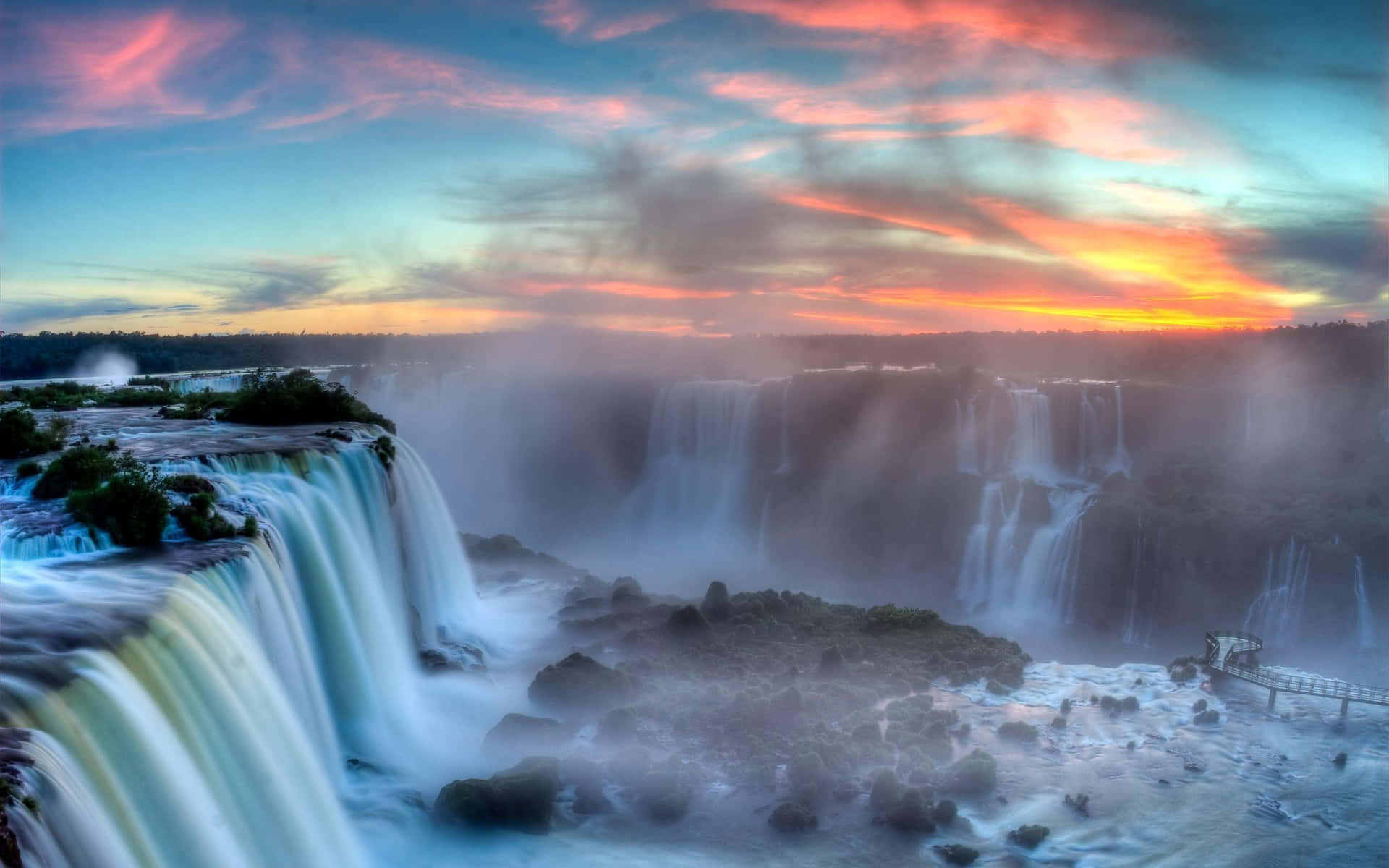 Fiery Sky On Iguazu Falls Background