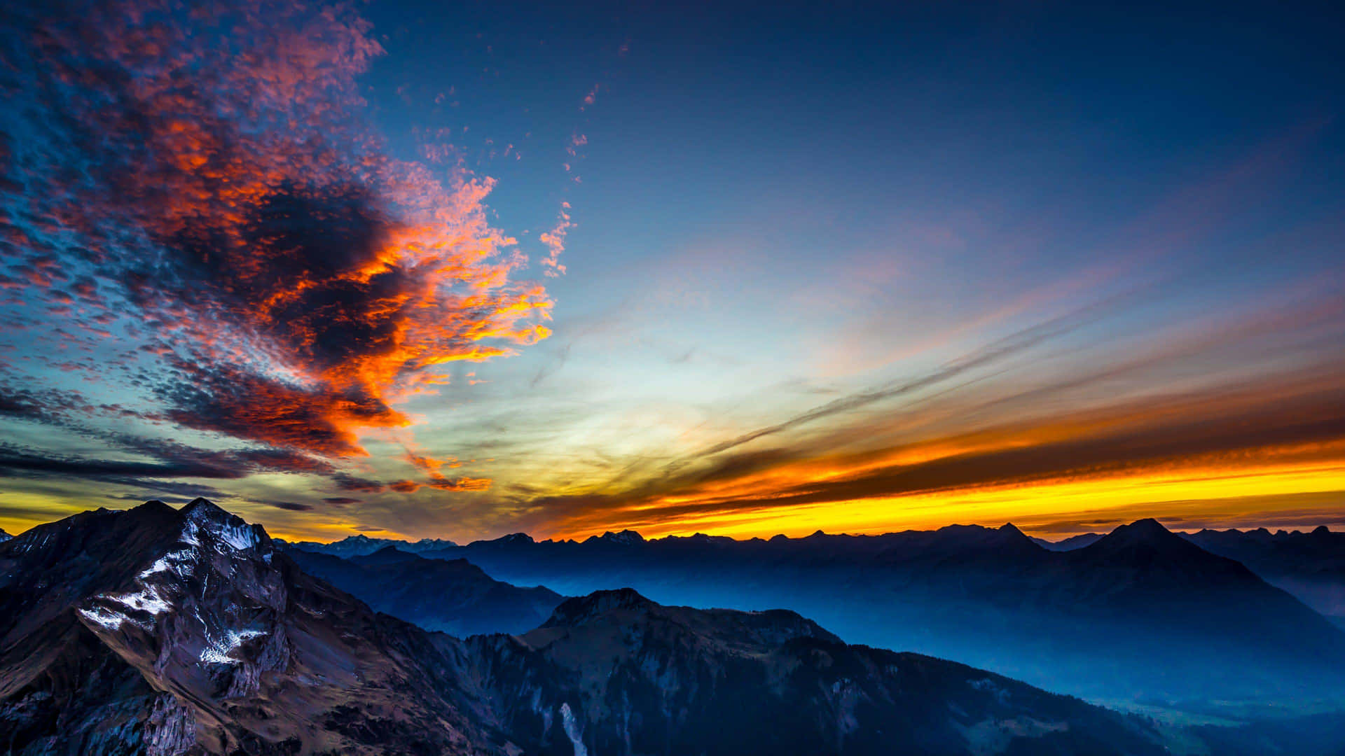 Fiery_ Sky_ Over_ Mountain_ Range Background