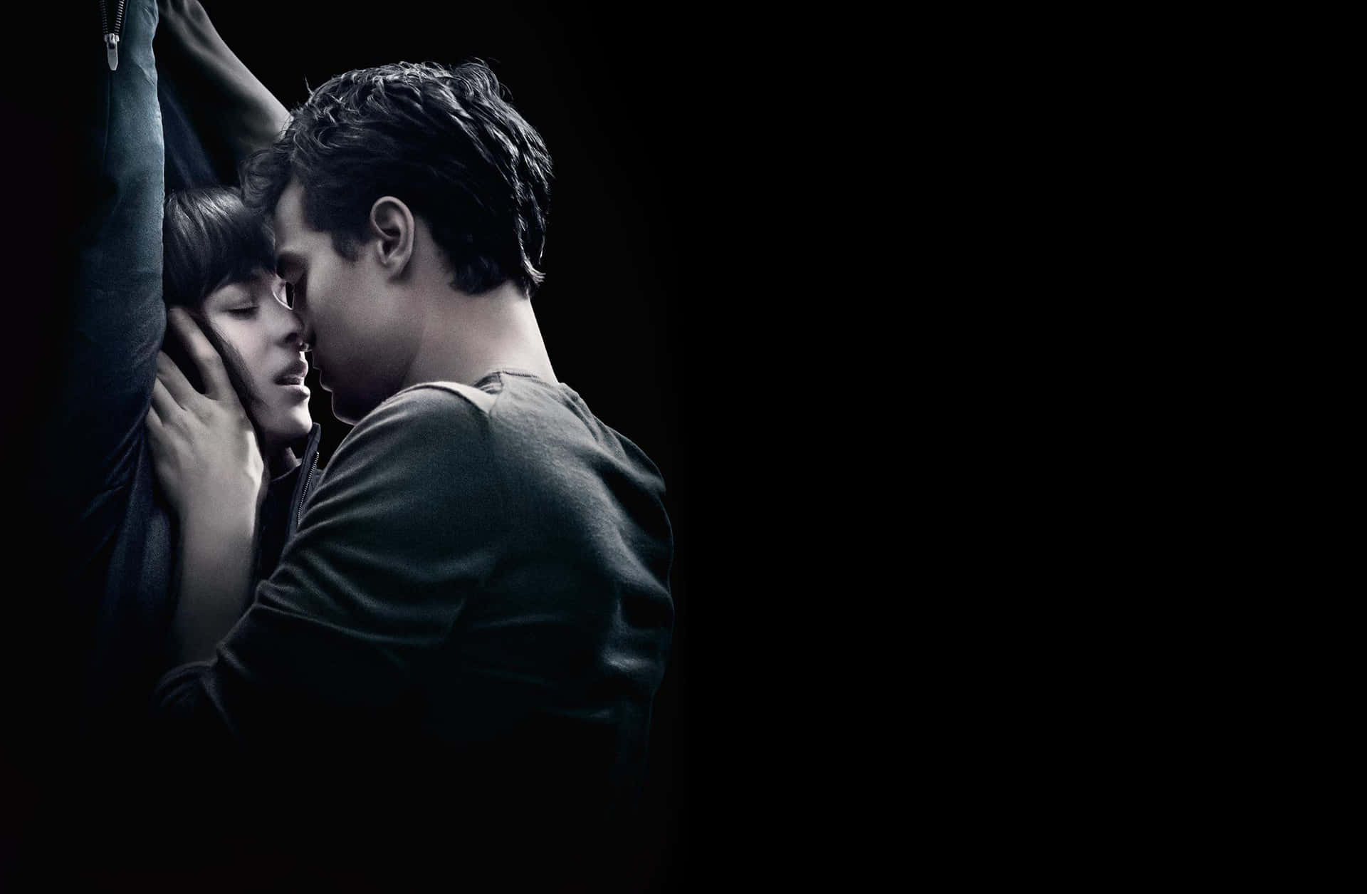Fifty Shades Of Grey Couple Sharing A Kiss Background