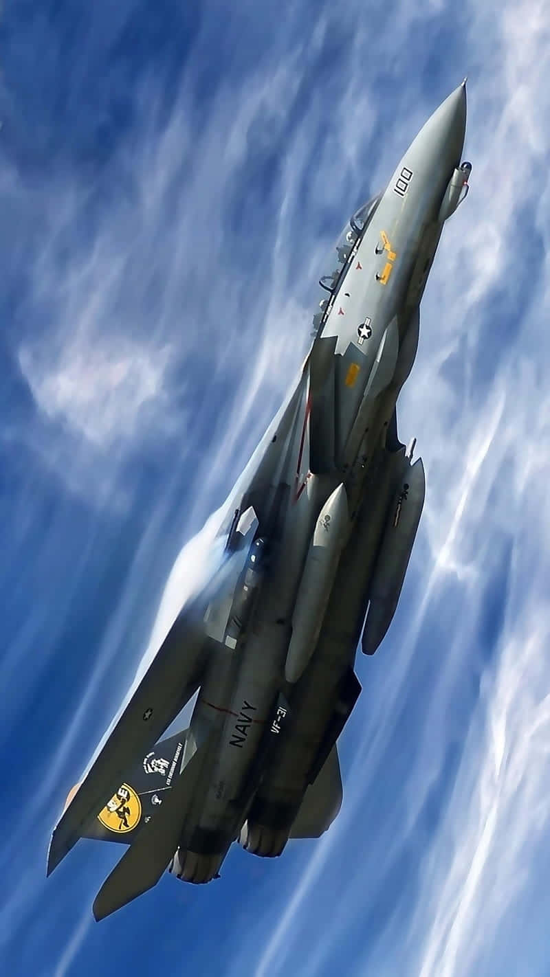 Fighter_ Jet_ Ascending_ Against_ Blue_ Sky Background