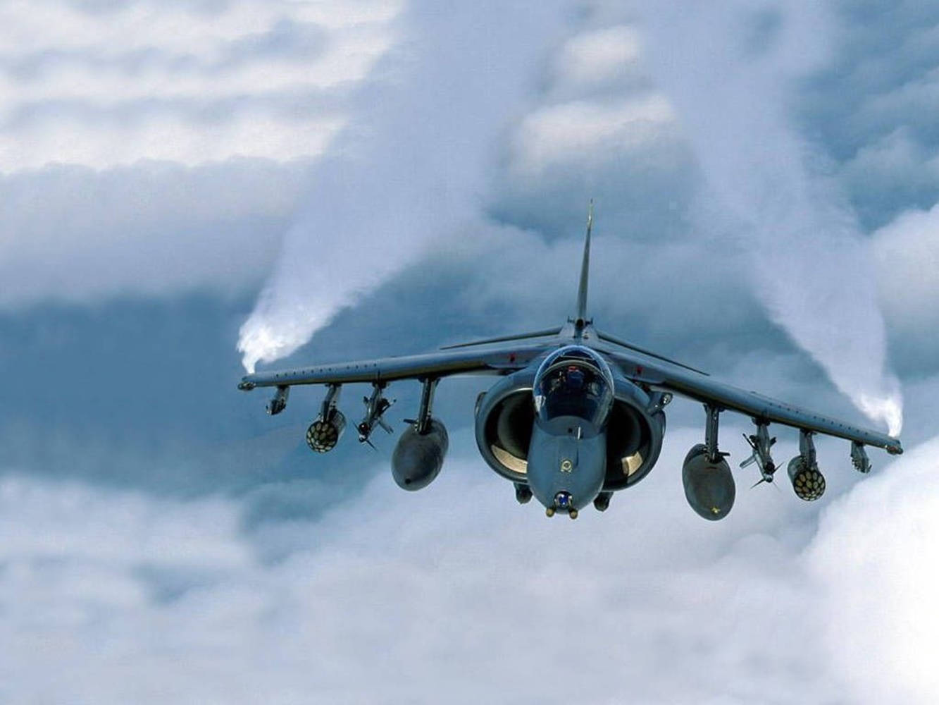 Fighter Jet Demonstrating Aerial Mastery Background