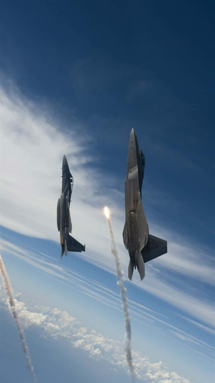 Fighter Jets Maneuveringin Sky Background