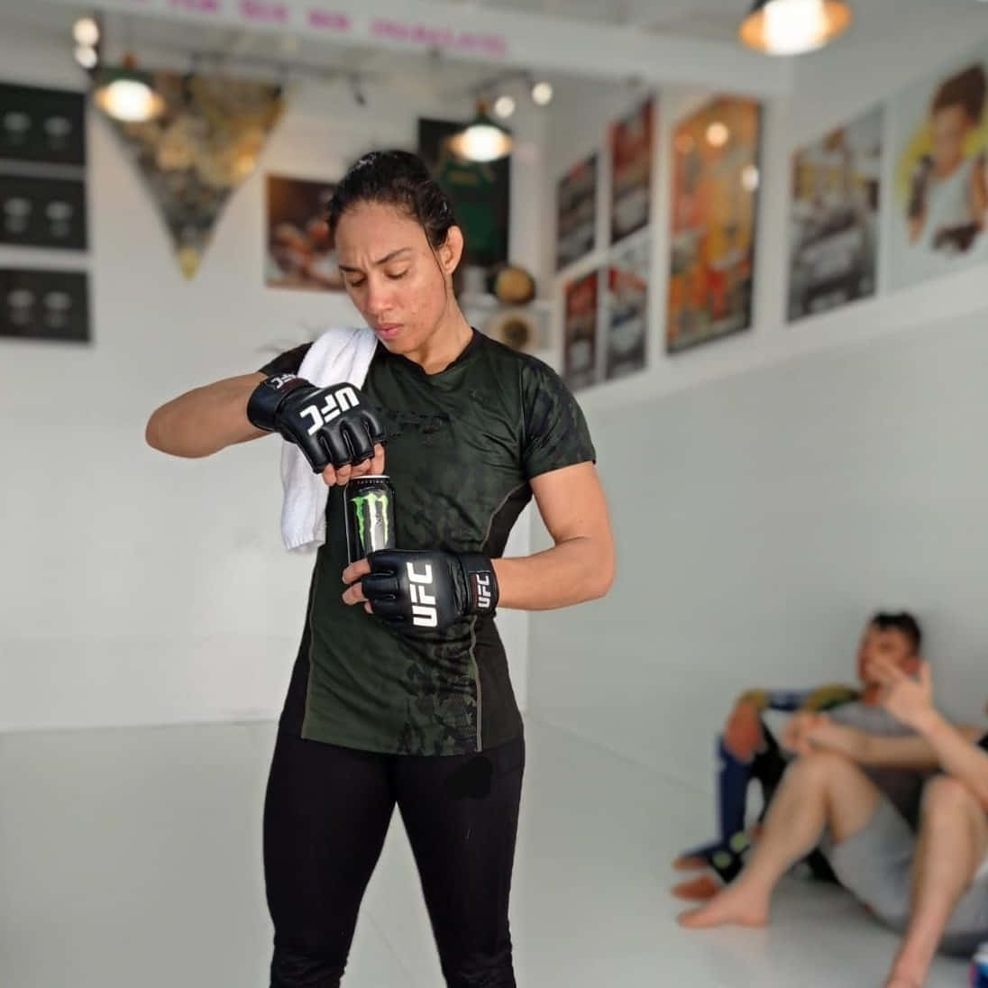 Fighter Taila Santos Opening A Can Of Monster Energy Drink.