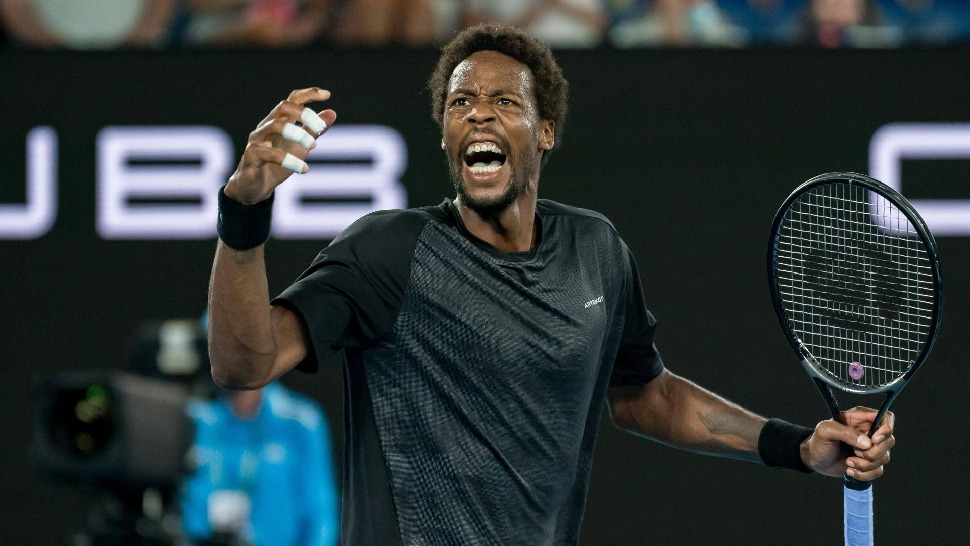 Fighting Spirit Unleashed: Gael Monfils In Action Background