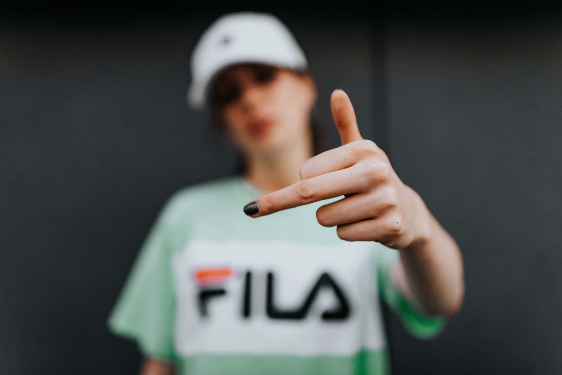 Fila T-shirt - A Woman Showing The Thumbs Up Background