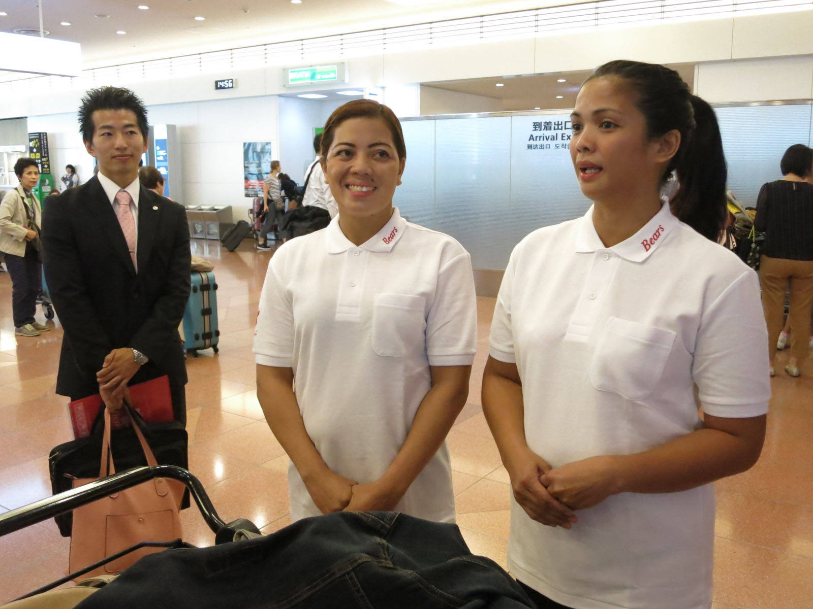 Filipino Housekeepers Arrive In Tokyo Japan Background