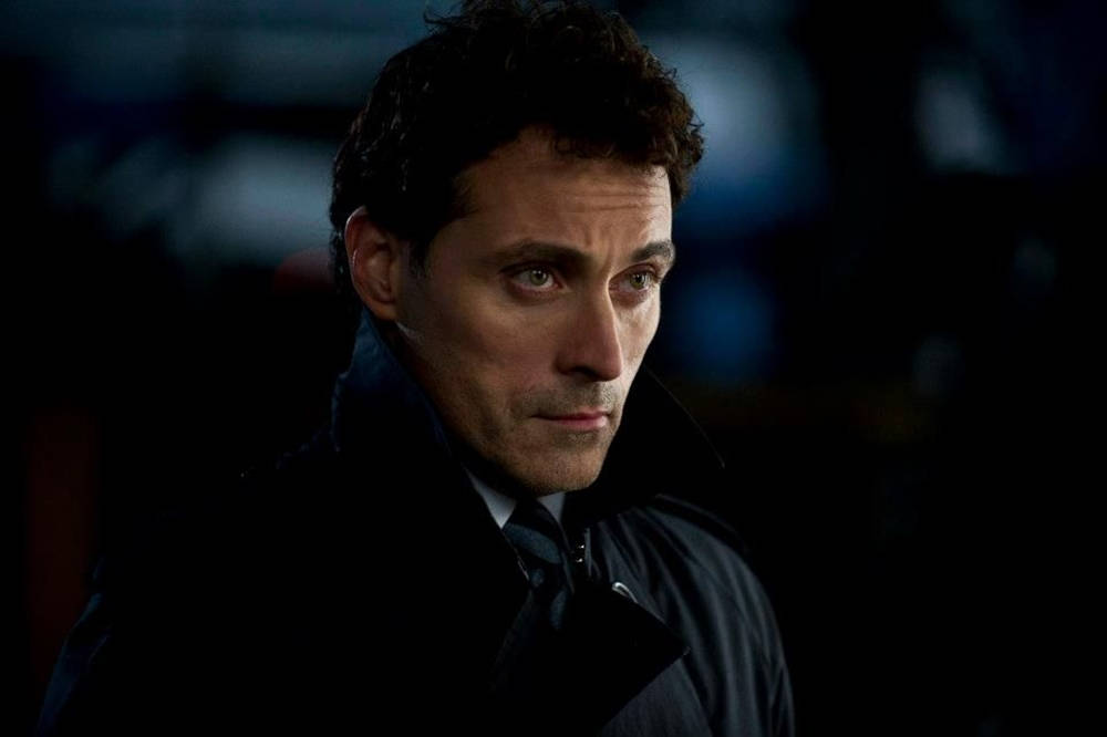 Film Actor Rufus Sewell Intimidating Gaze Background