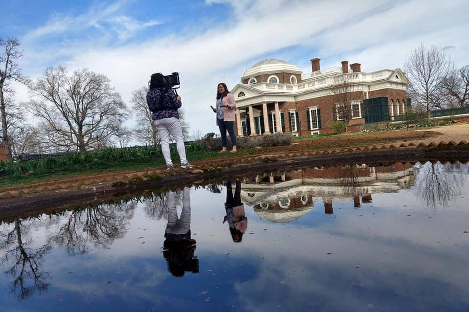 Film Crew Capturing The Majestic Beauty Of Monticello Background