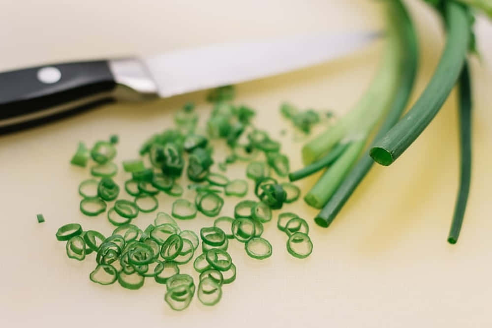 Fine Cuts Of Green Chives Background