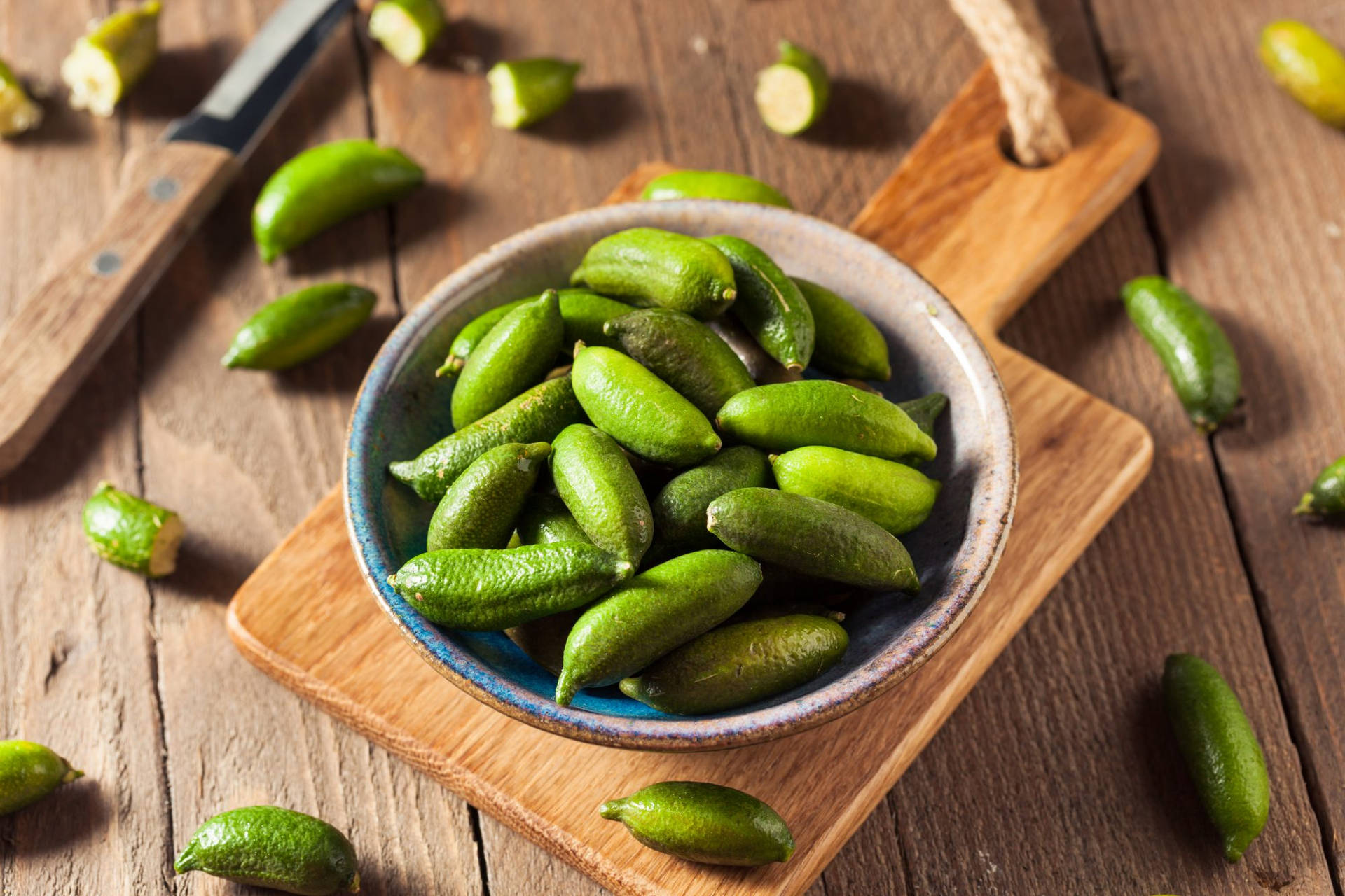 Finger Limes On A Bowl Background