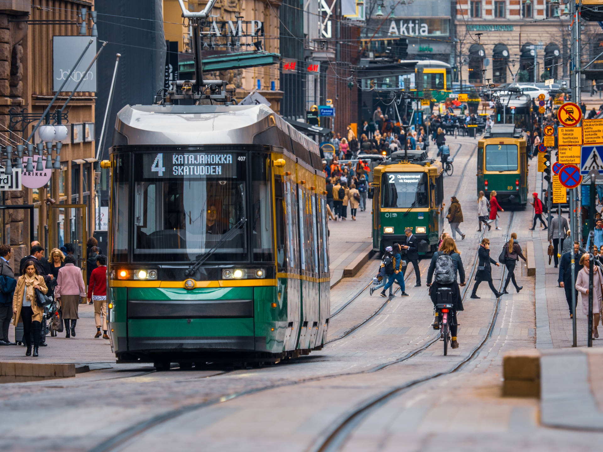 Finland Trams At Busy Street Background