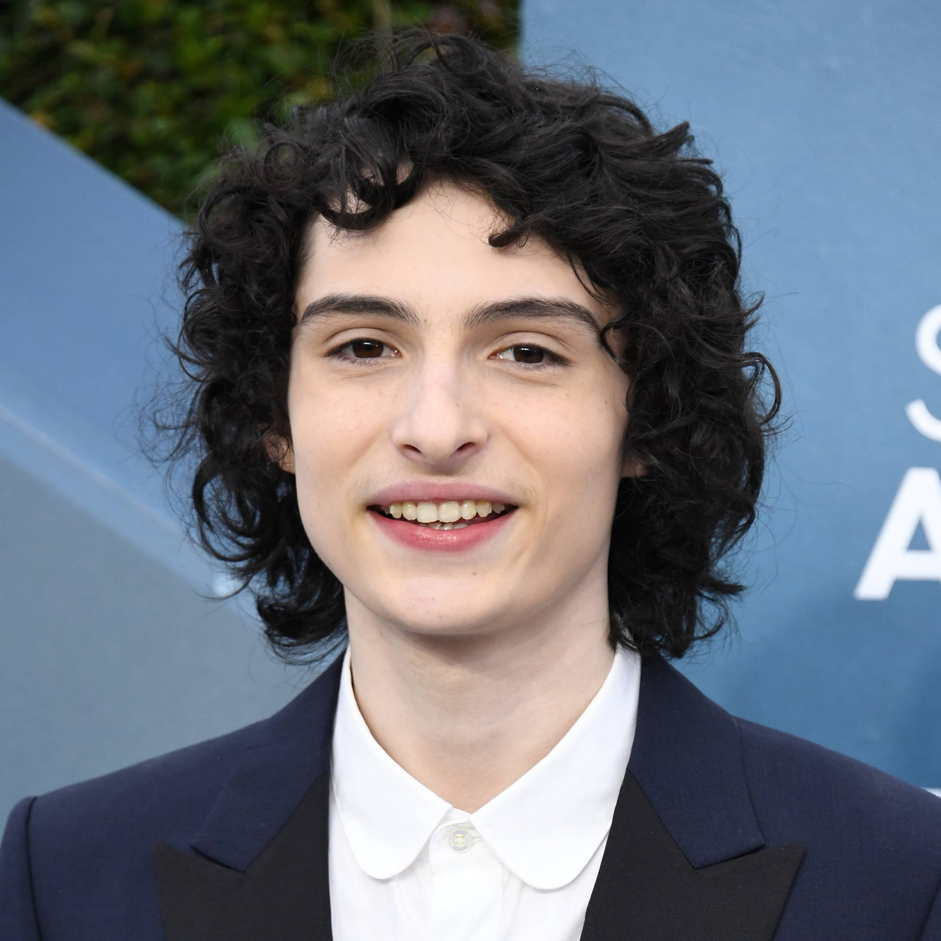 Finn Wolfhard In Coat And Tie