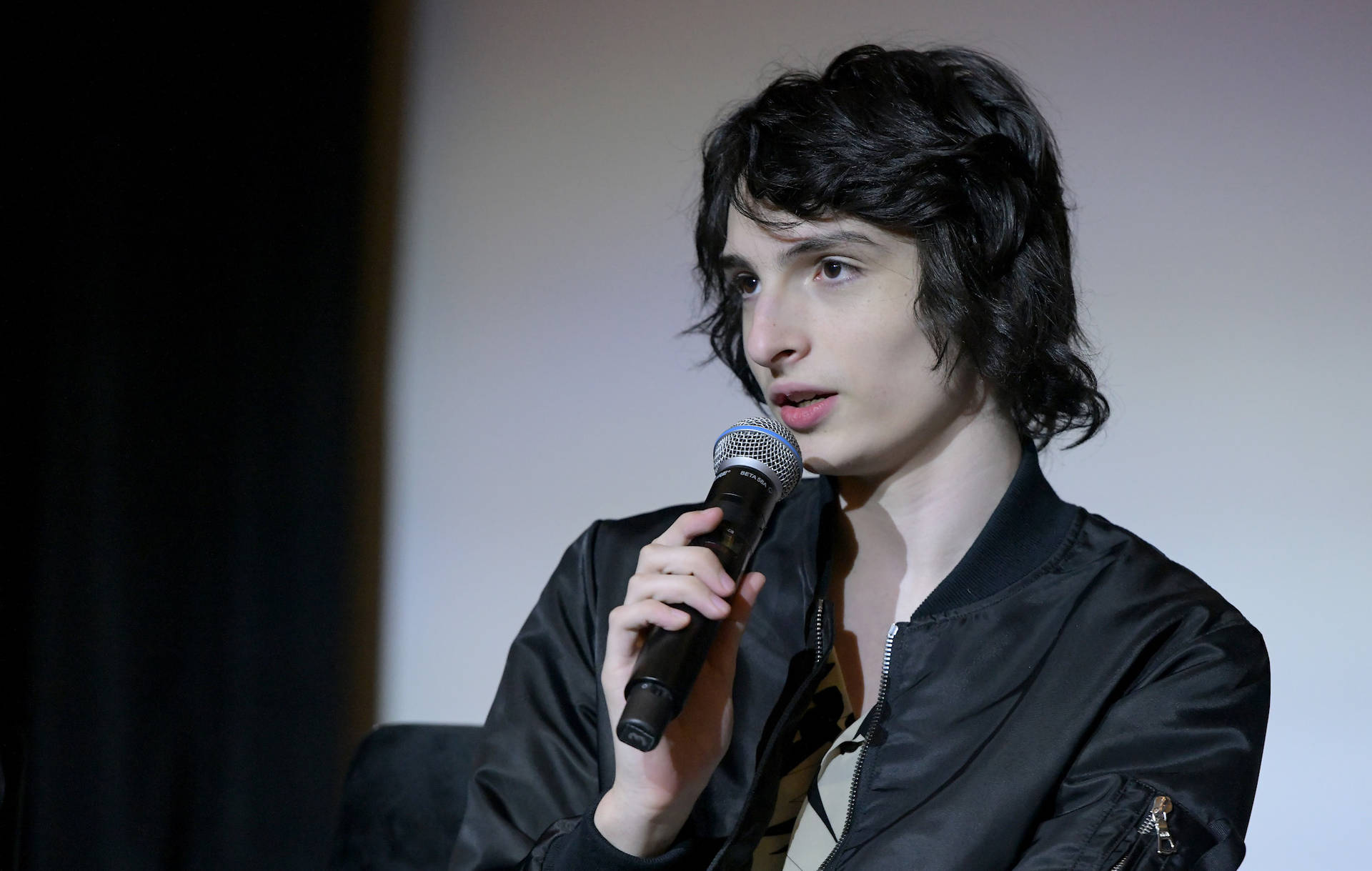 Finn Wolfhard With Mic Background