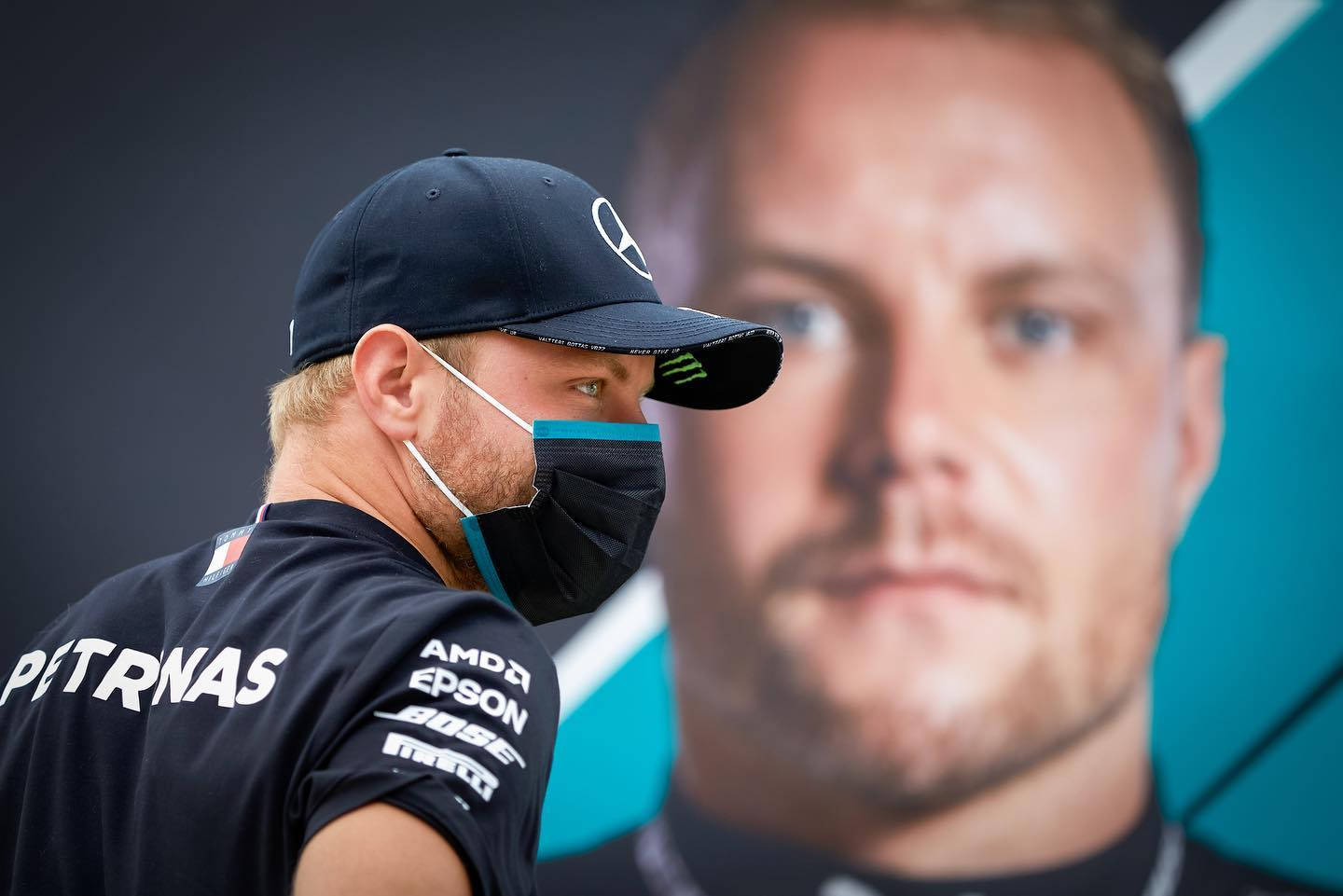 Finnish F1 Racer Valtteri Bottas With Face Mask Background