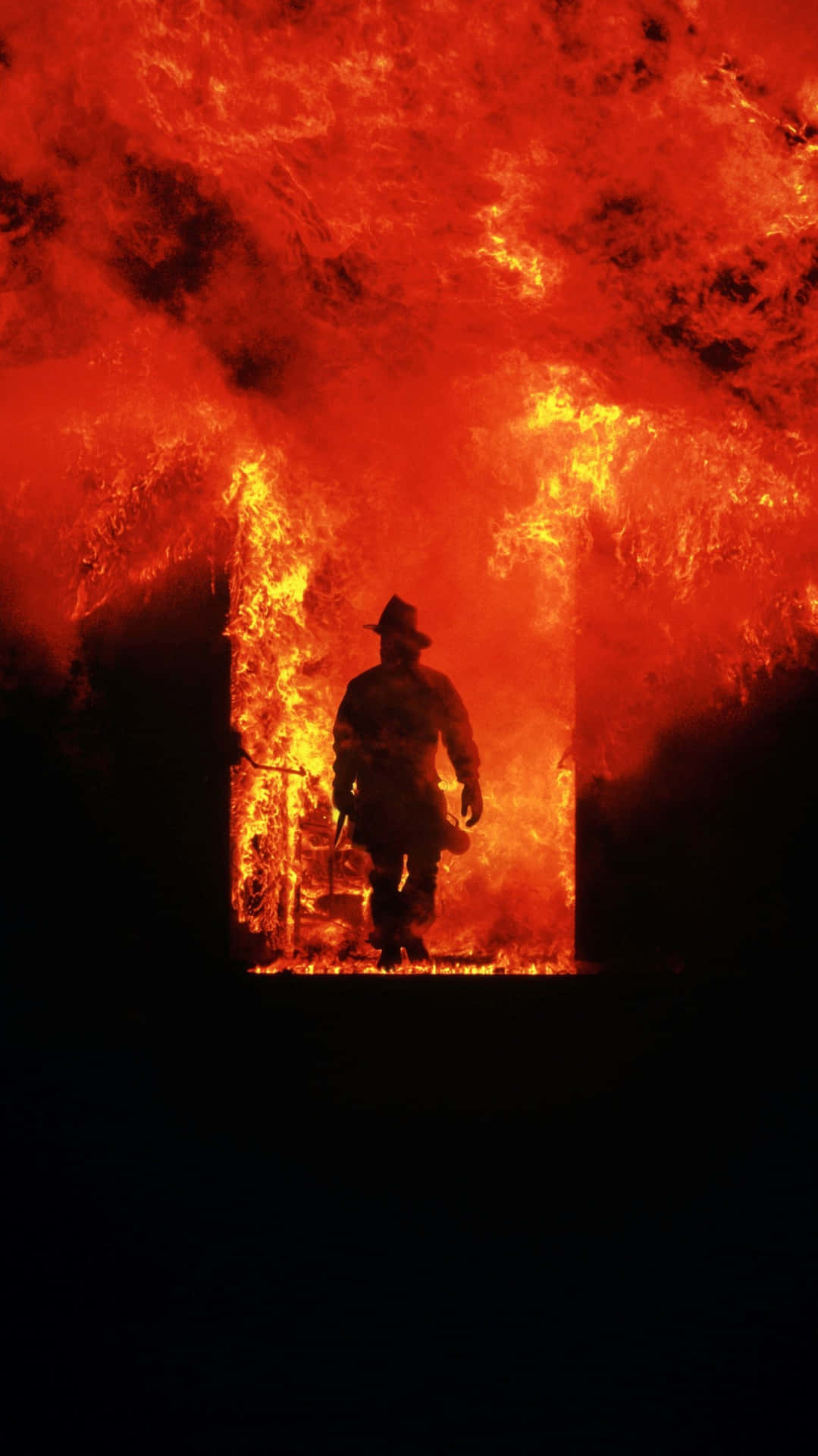 Fire Department Officer In A Flaming Building Background