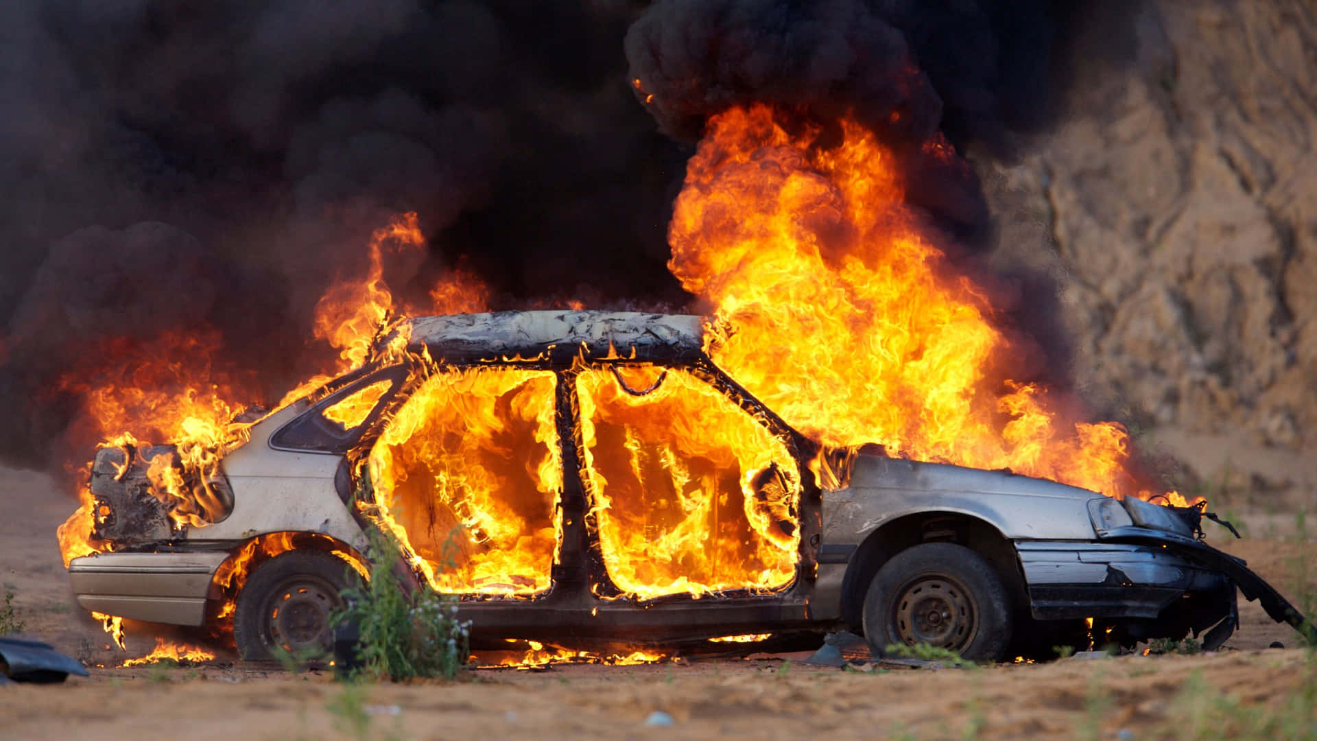 Fire Fighters Bravely Using Their Fire Cars To Put Out A Fire Background