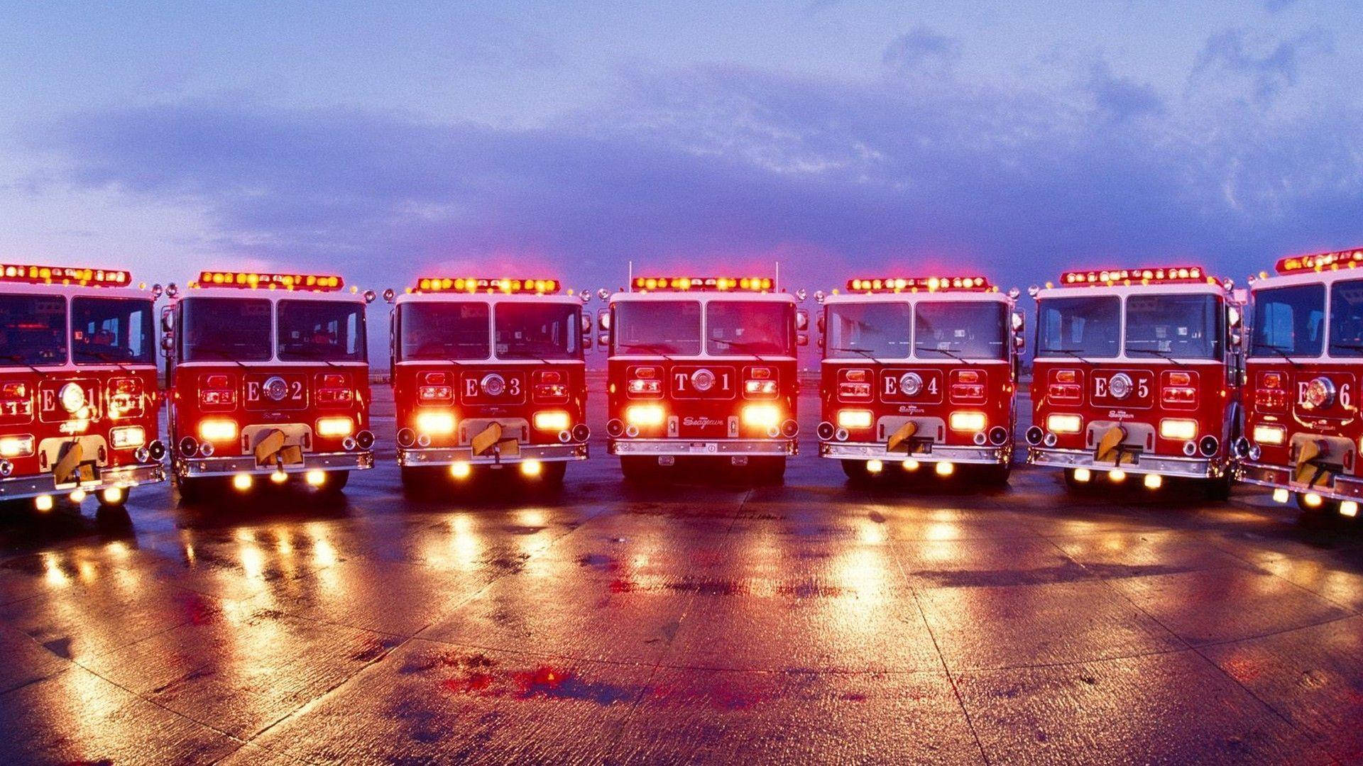 Firefighter Firetrucks At Dawn Background