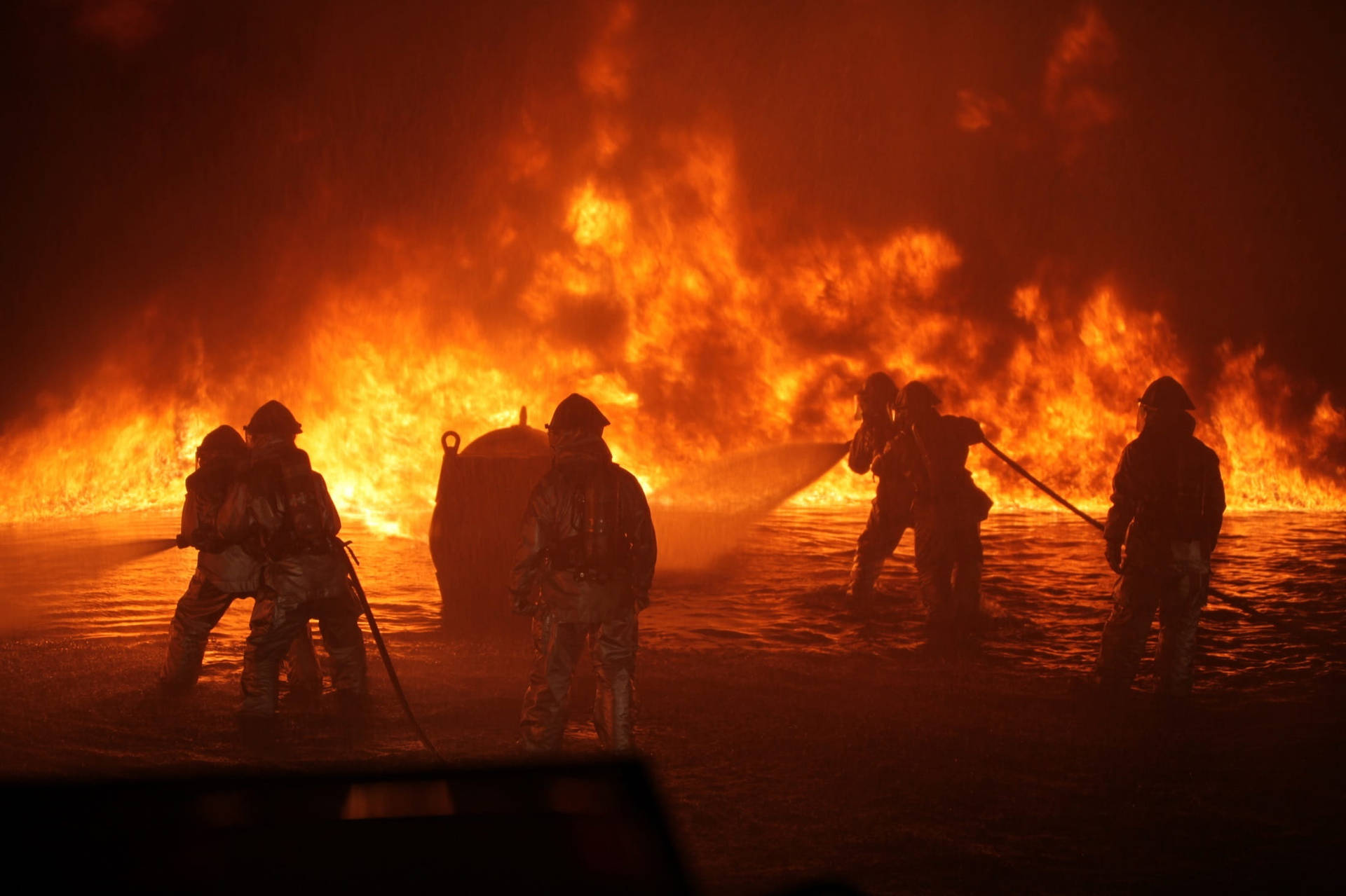 Firefighters Responding To Fire On Water Background