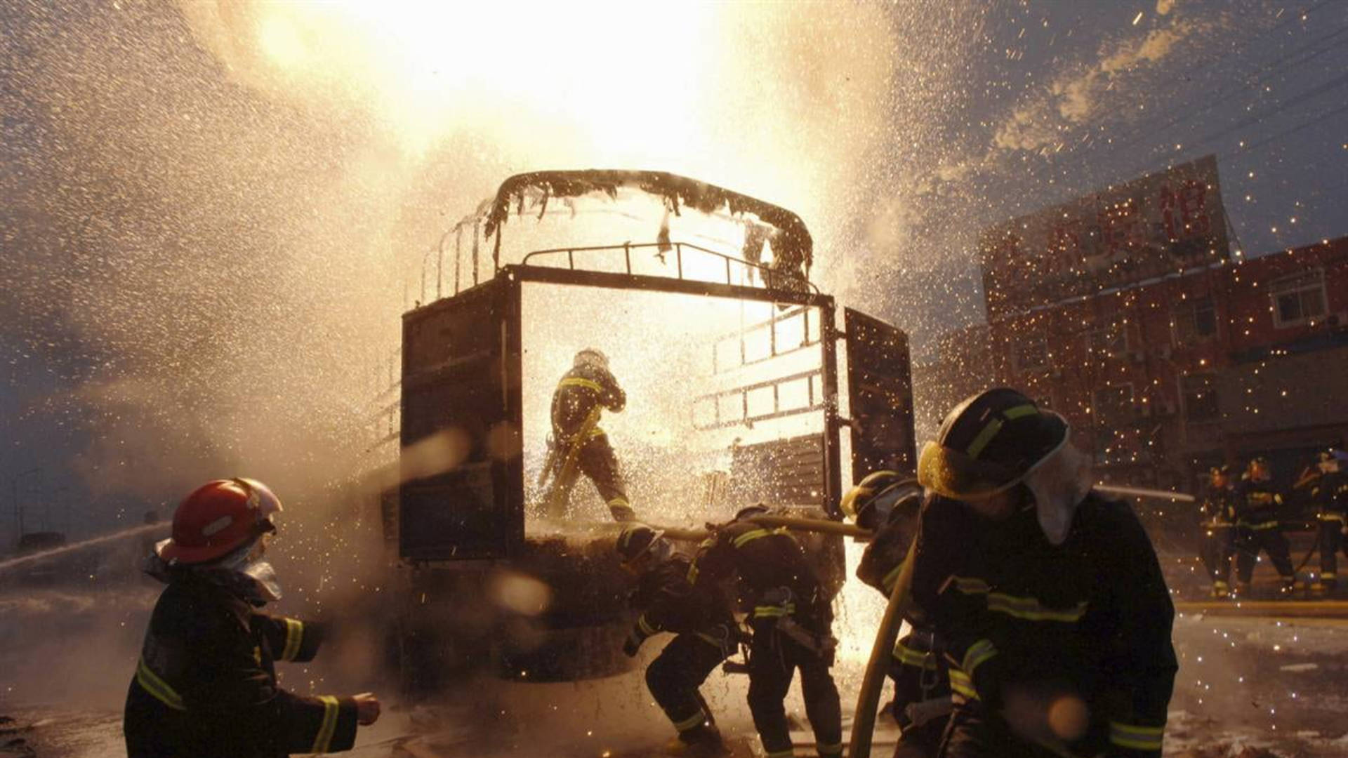 Firefighters Saving A Burning Vehicle