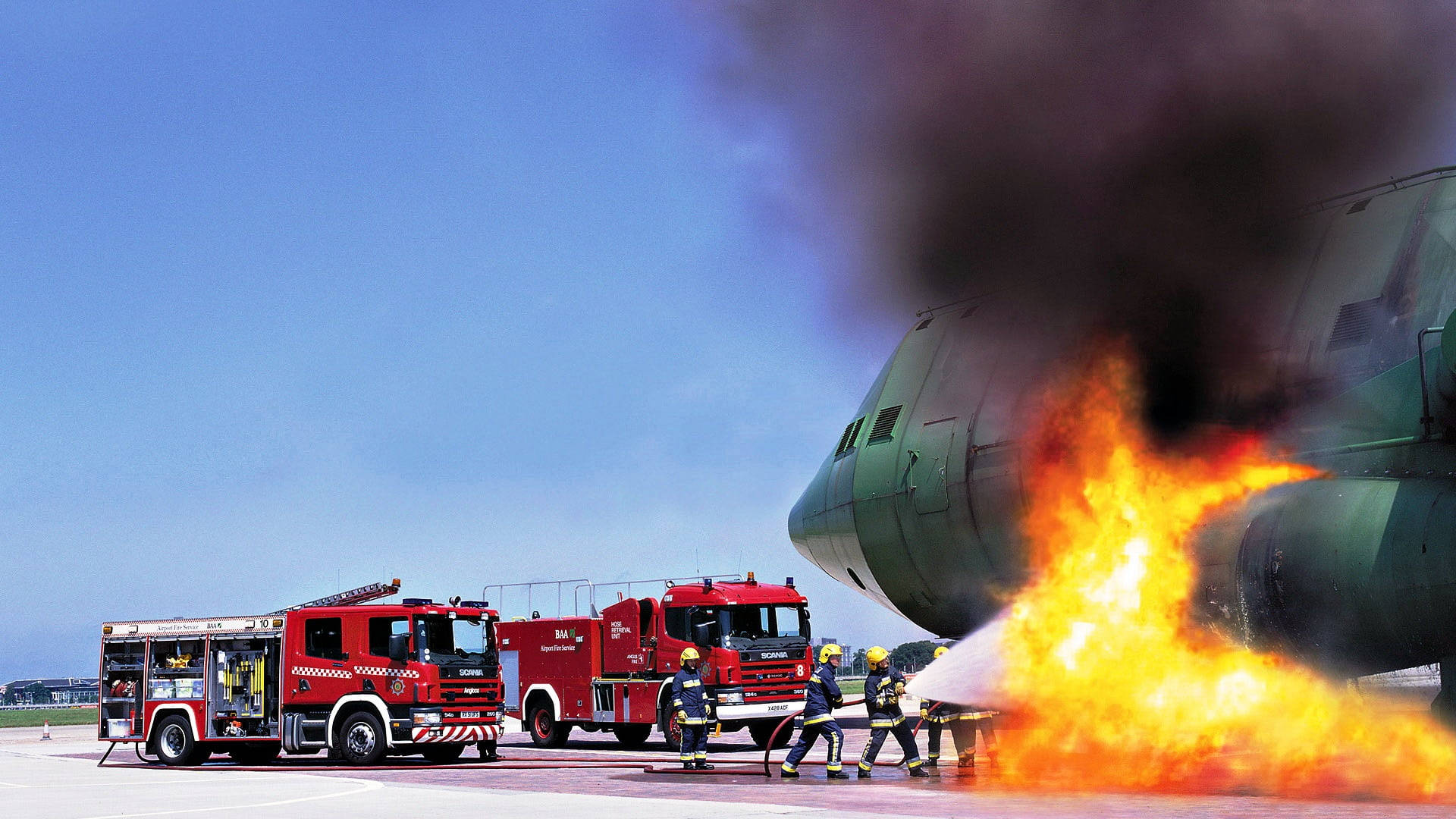 Firefighters Saving An Aircraft Background