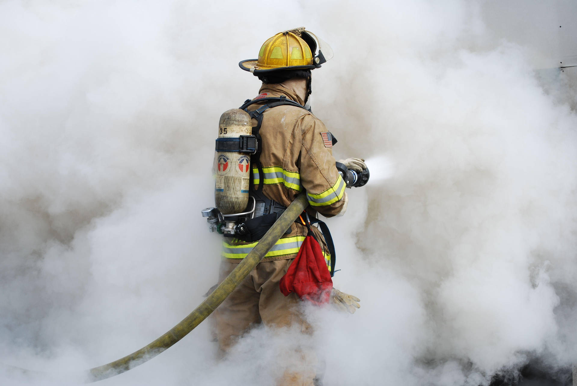 Fireman In A Thick White Smoke Background