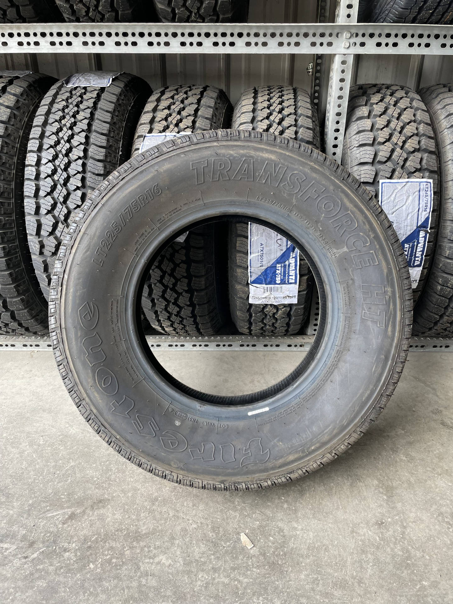 Firestone Tire With Rows Of Tires Background