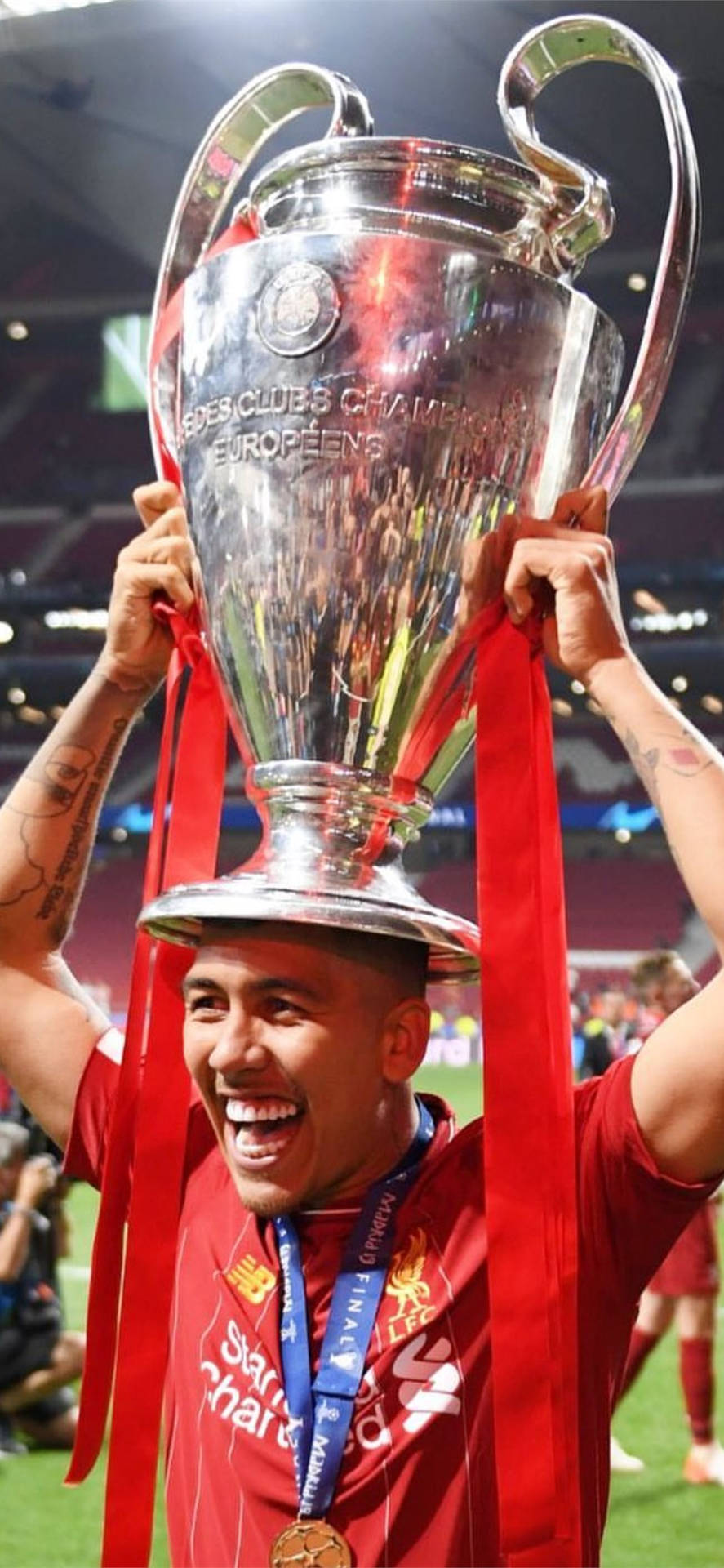 Firmino Holding Champions League Trophy Background