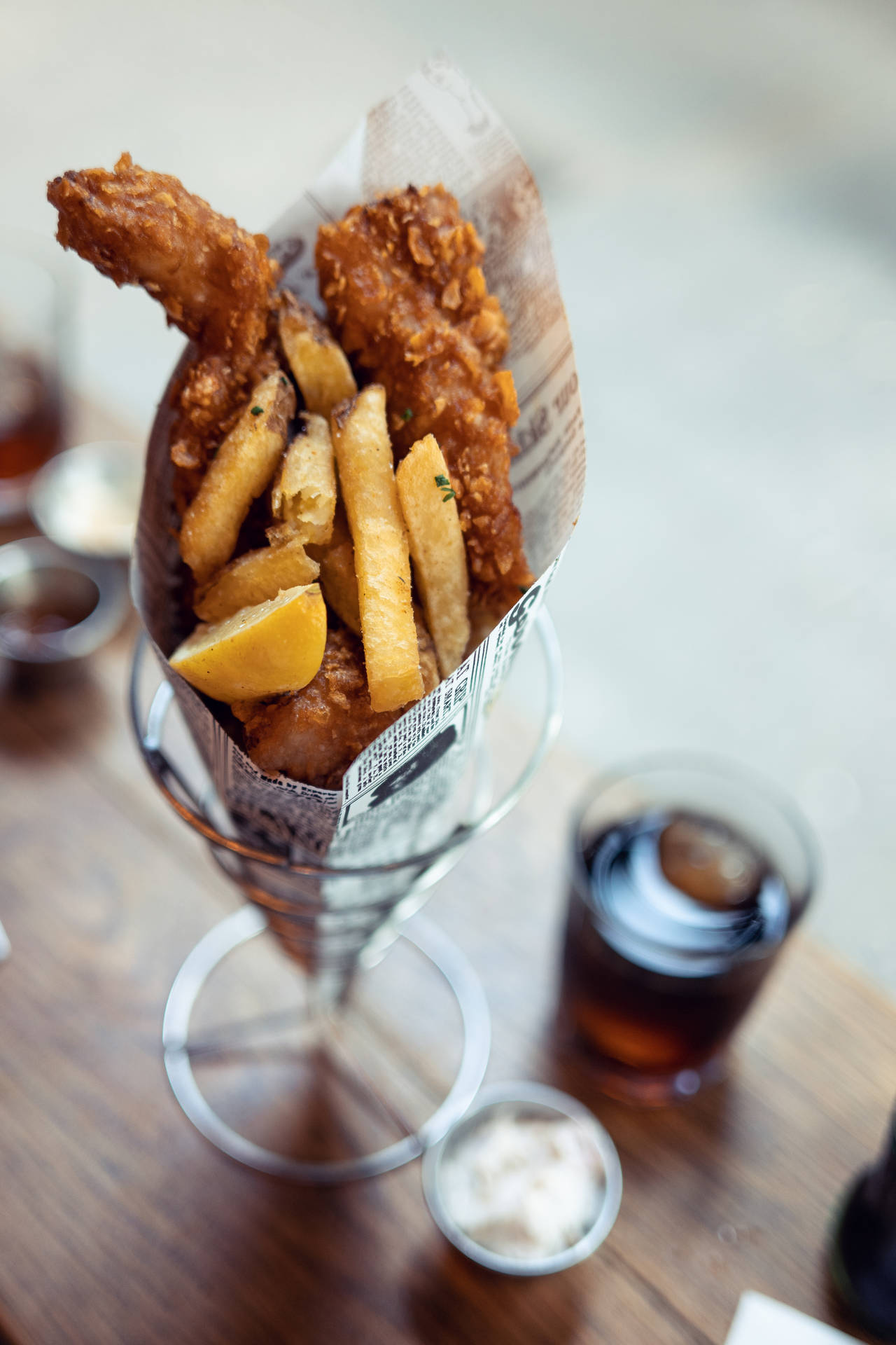 Fish And Chips On A Paper Background