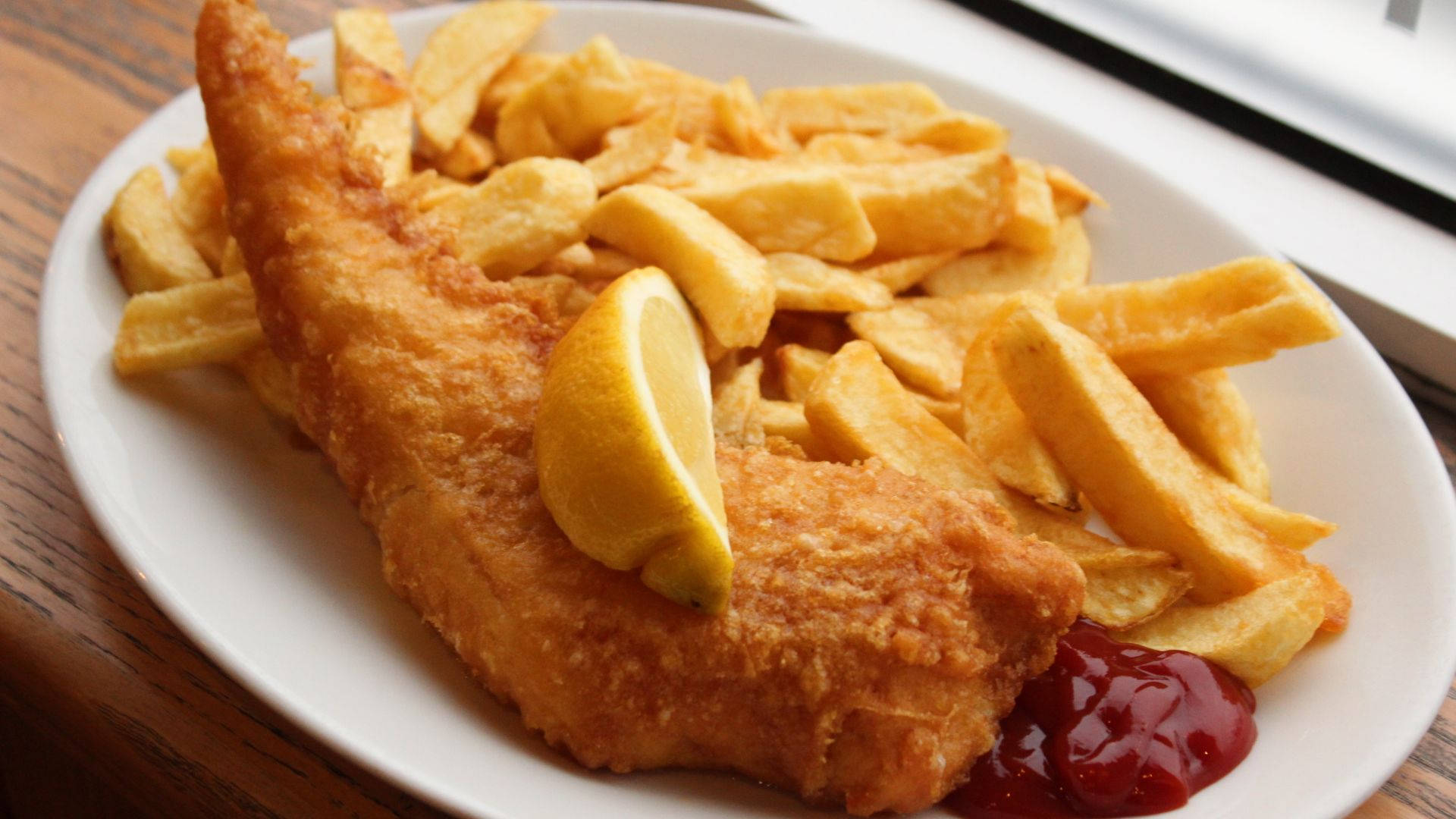 Fish And Chips With Lemon And Ketchup