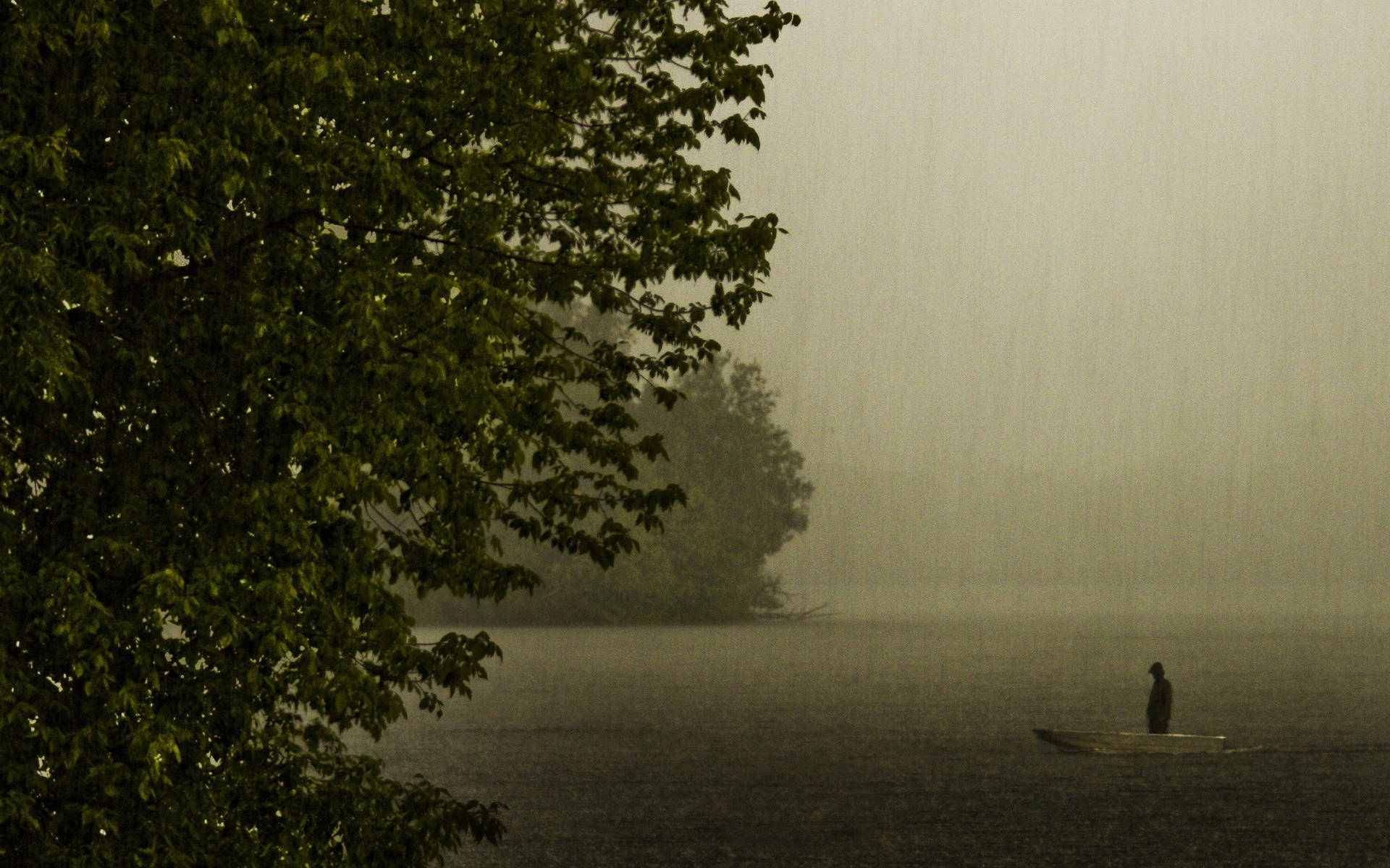 Fisherman During A Beautiful Rain Downpour