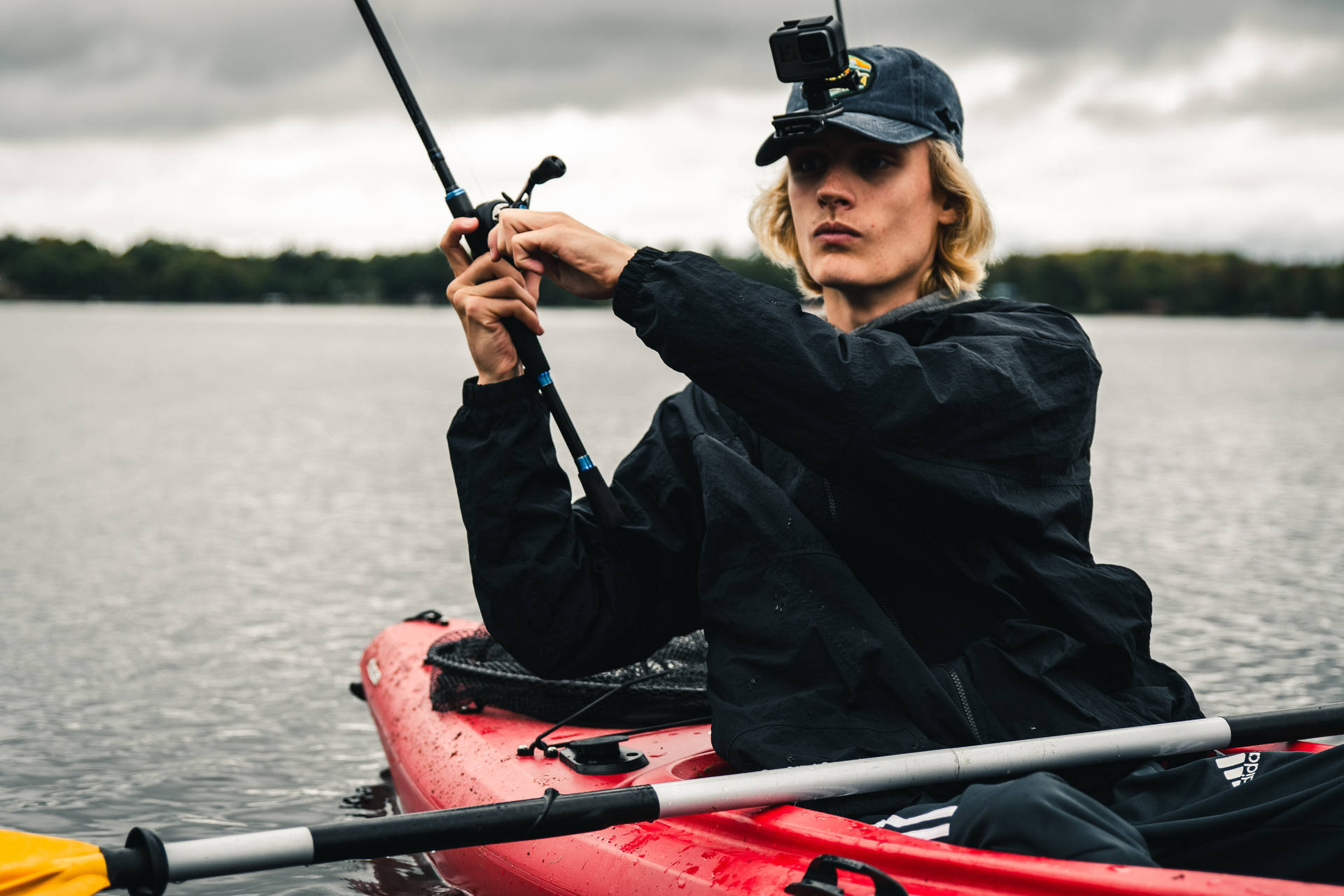 Fisherman With A Gopro On His Hat Background