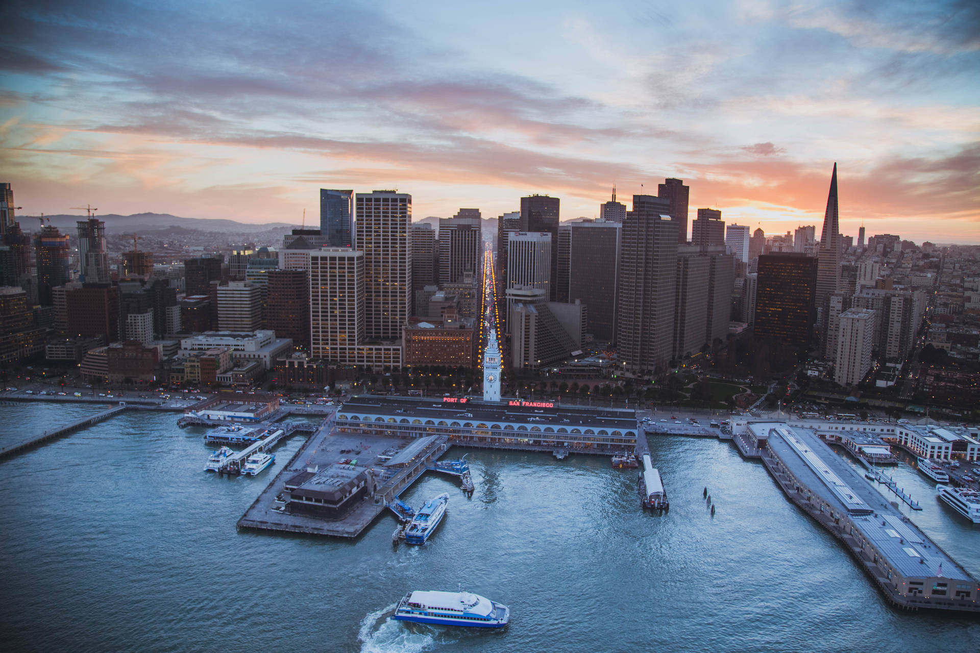 Fishermans Wharf And City Skyline Background