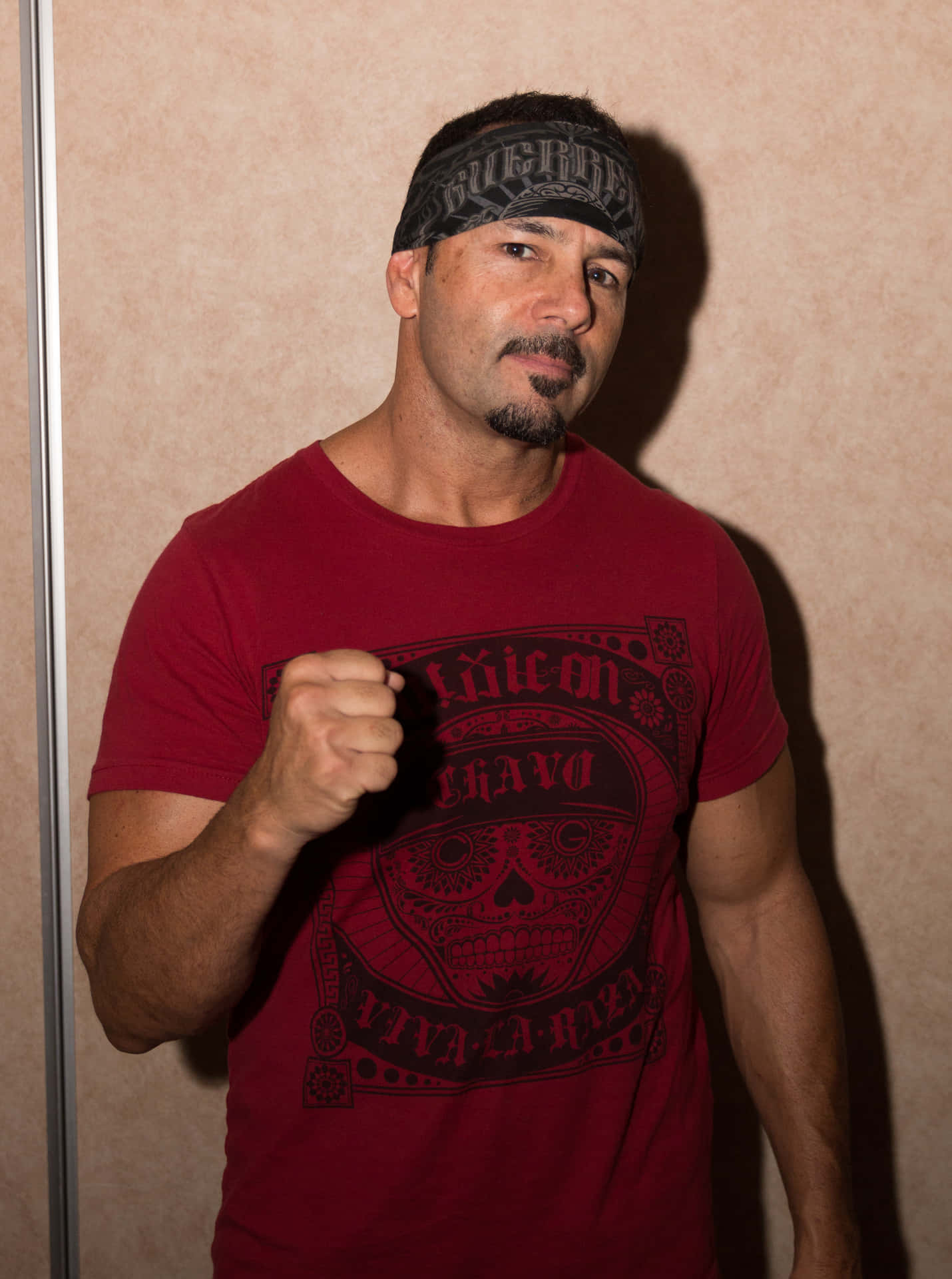 Fist Up Pose Chavo Guerrero Background