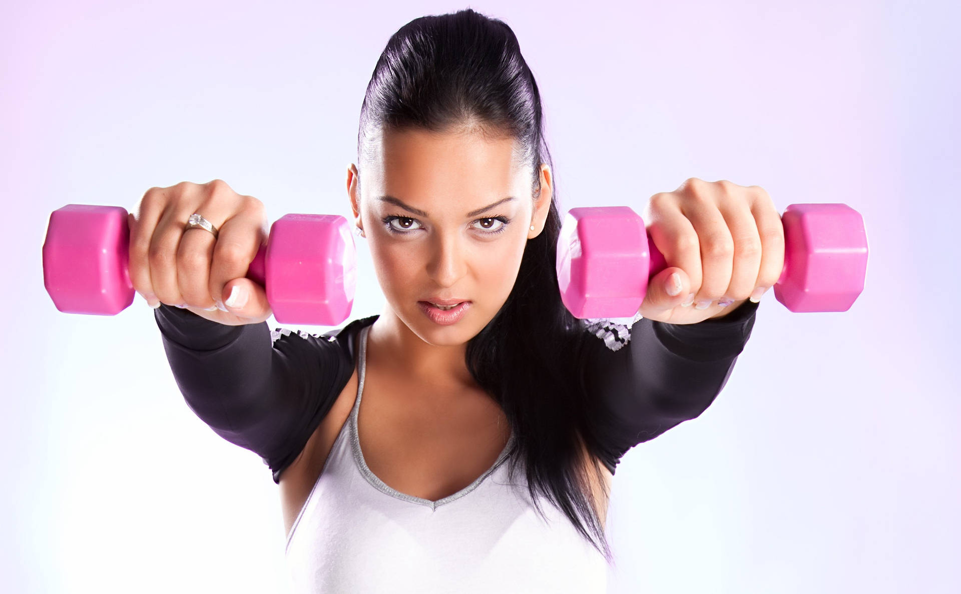 Fit Woman Holding Pink Dumbbells Background