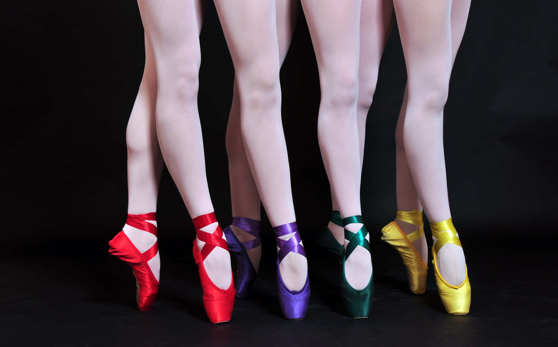 Five Ballet Shoes With Colorful Ribbons Background