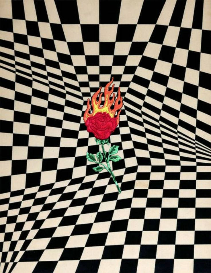 Flaming Rose Adorned Over Distorted Black And White Squares Background