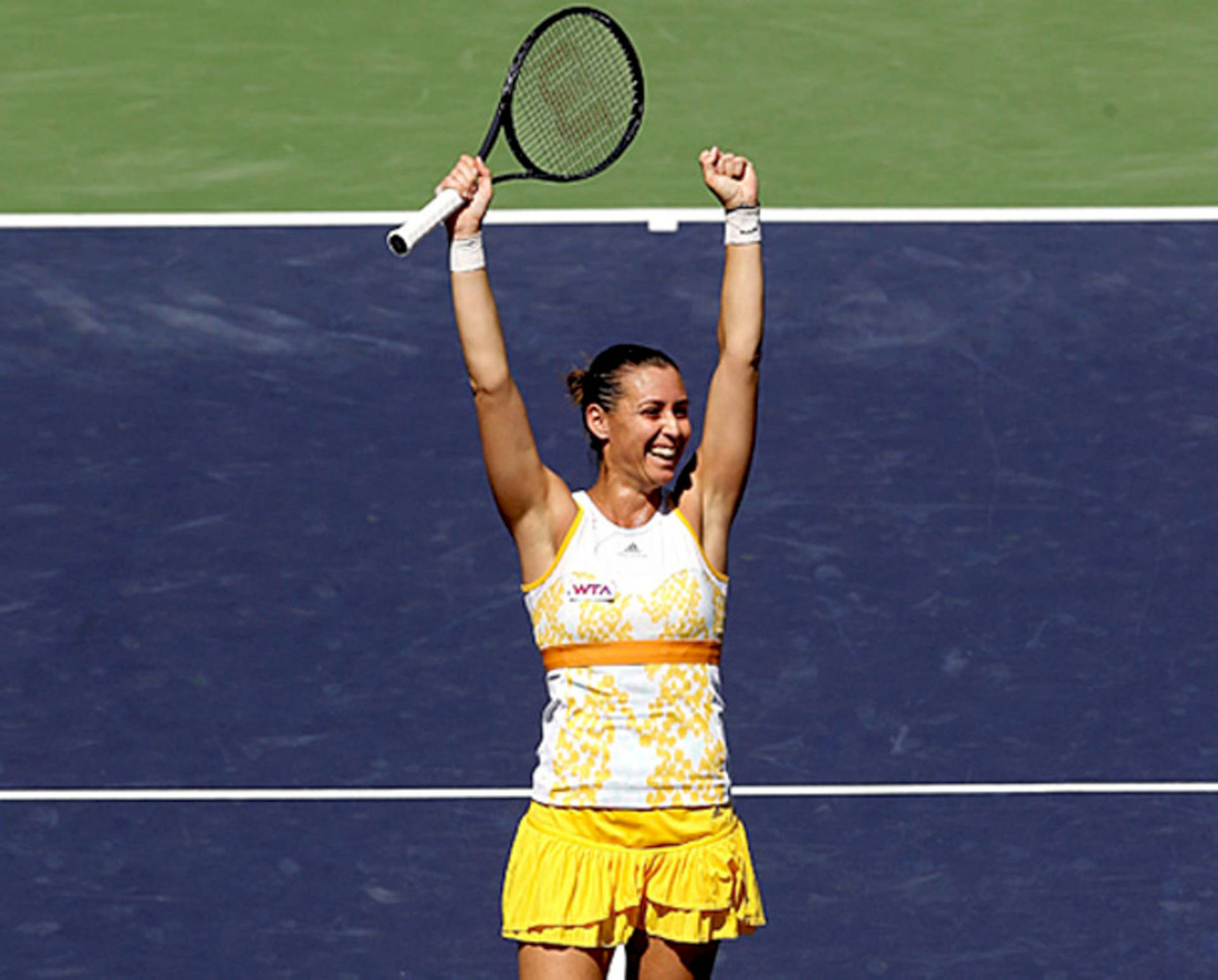 Flavia Pennetta Holding Racket Up