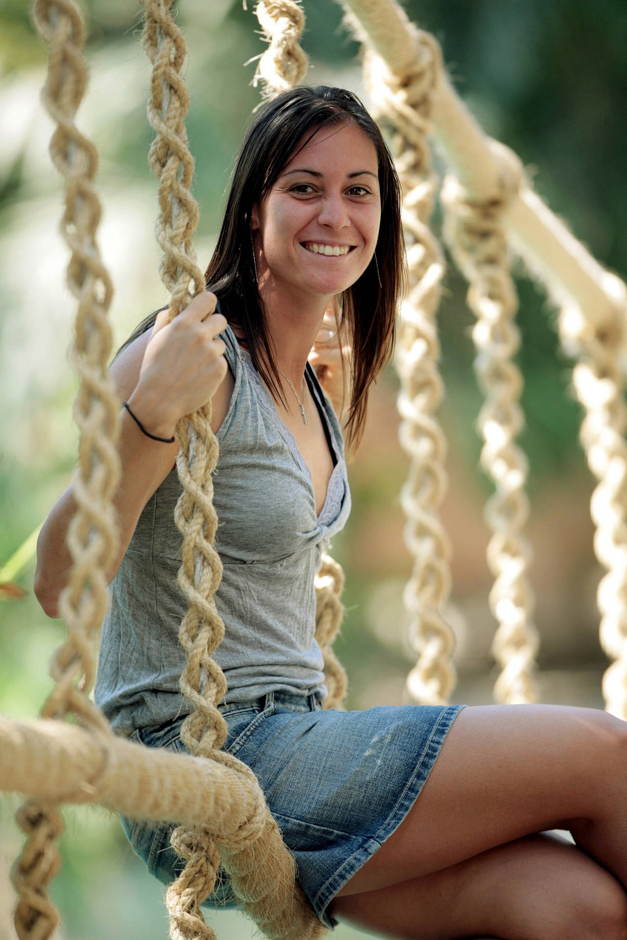 Flavia Pennetta Sitting On Swing Background