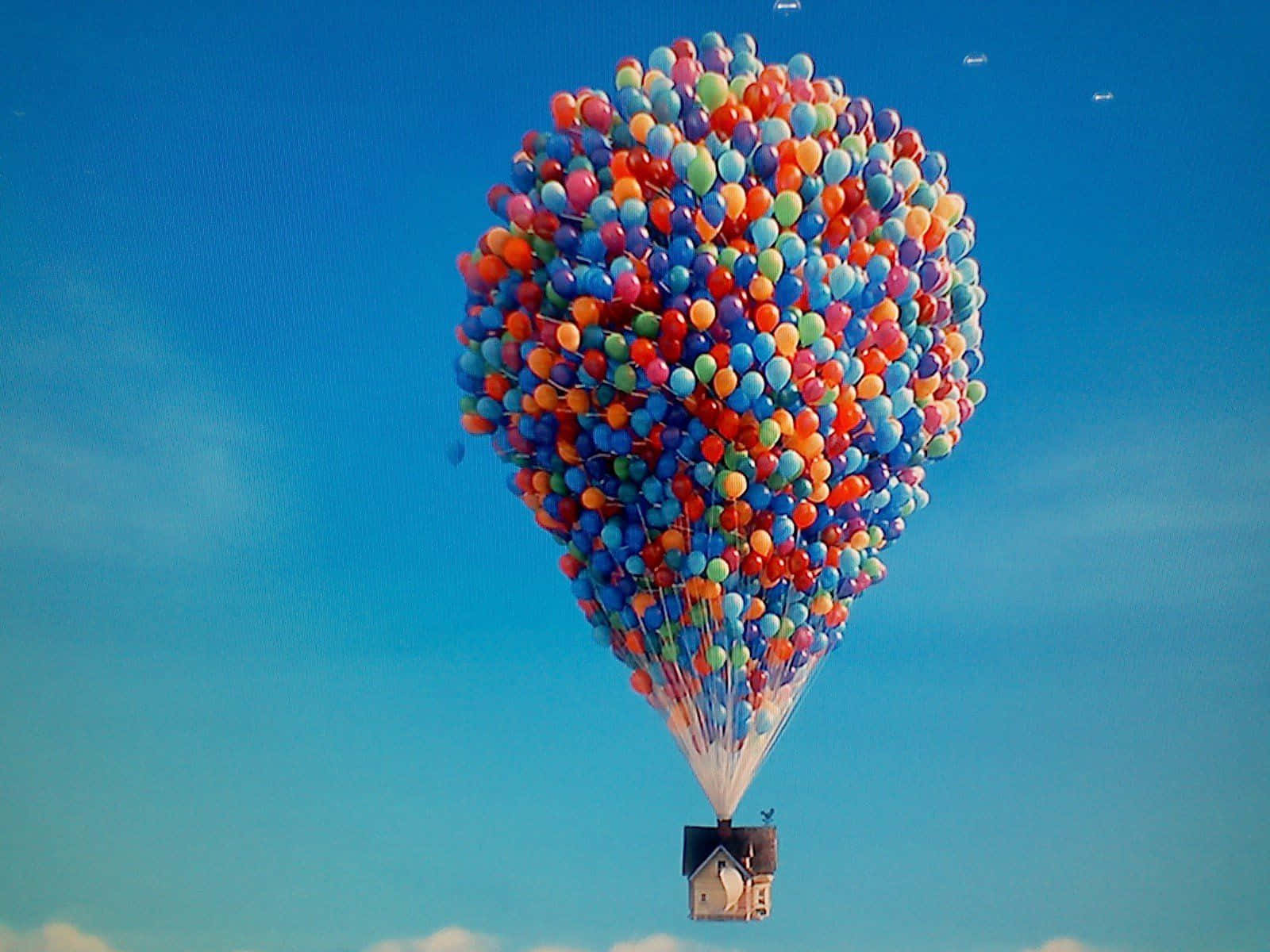 Floating House With Colorful Ballons In Up Movie Background