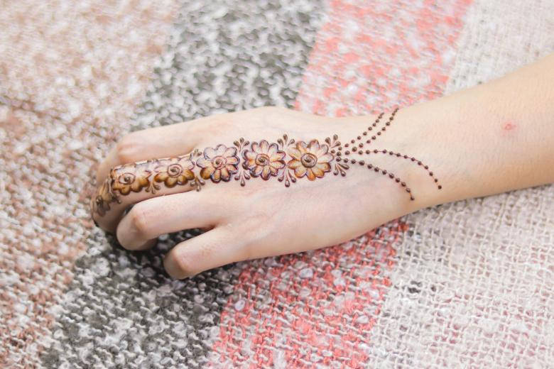 Floral Mehndi Design In An Indian Wedding Background
