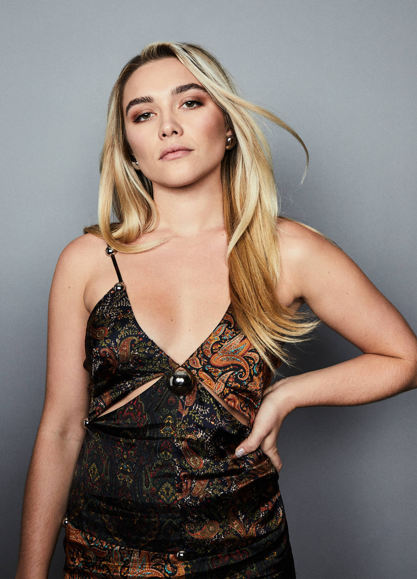 Florence Pugh Striking A Pose At The Wrap Event Background