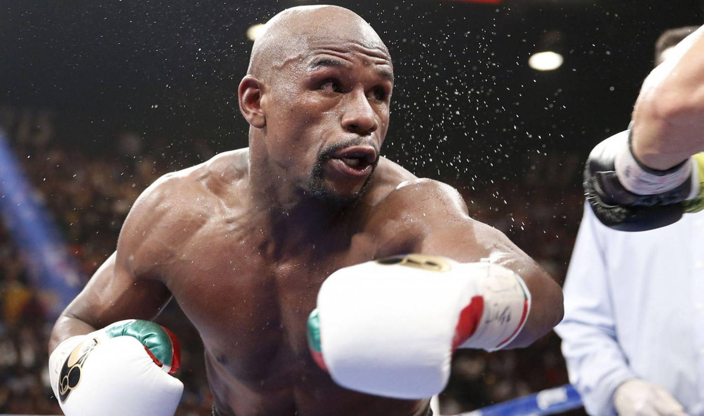 Floyd Mayweather Knocking Sweat Off His Foe Background