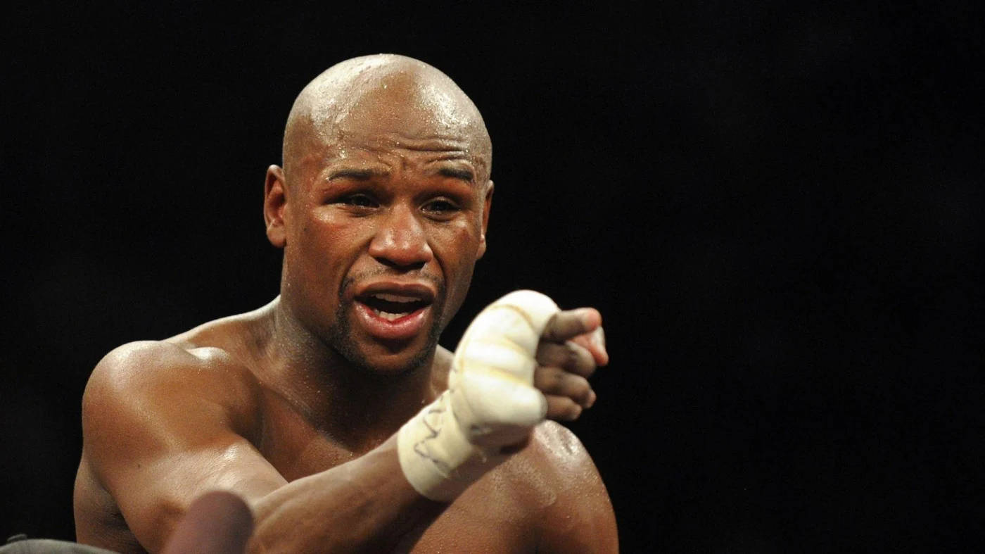 Floyd Mayweather Points At The Camera Background