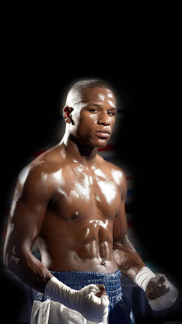 Floyd Mayweather Posing With Black Backdrop Background