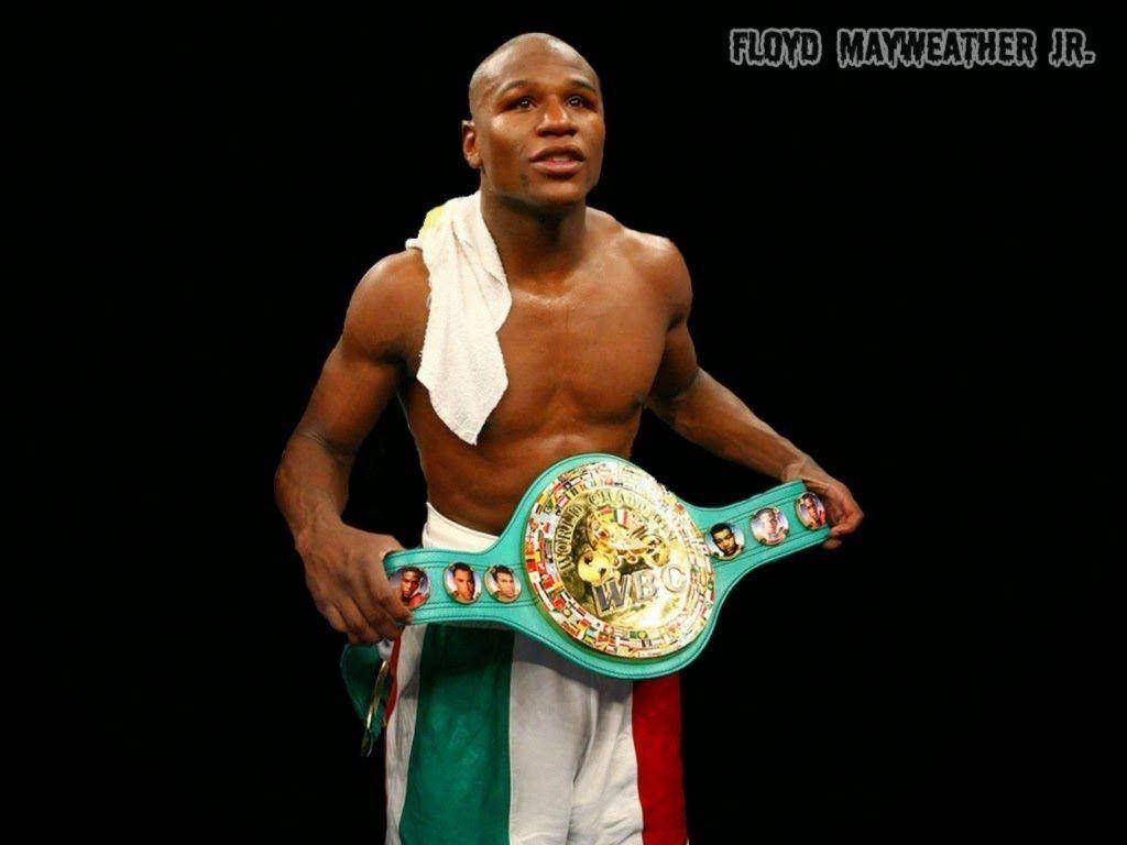 Floyd Mayweather Putting On The Belt Background