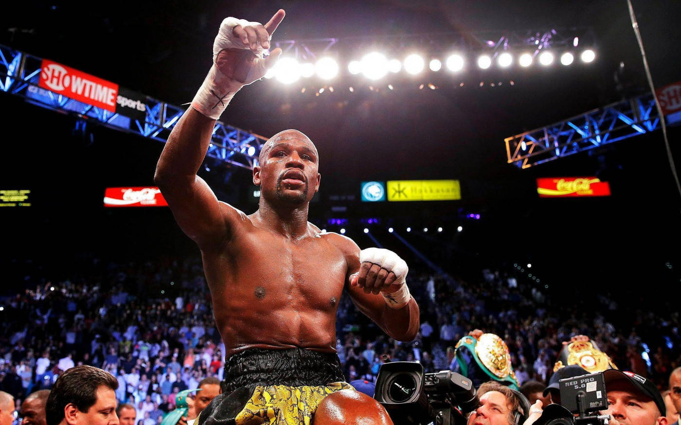 Floyd Mayweather Raising Finger Light Shining Background