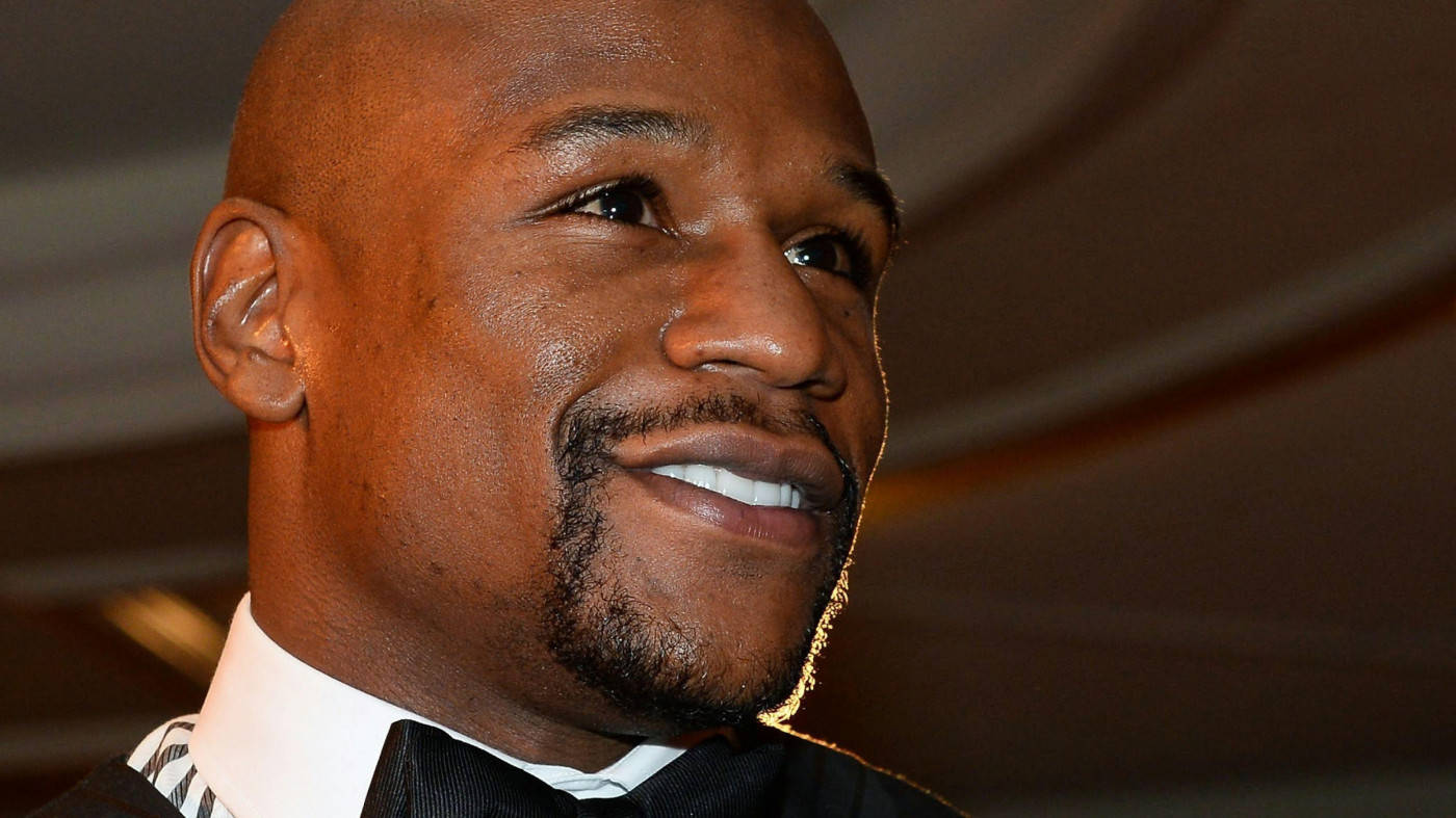 Floyd Mayweather Smiling In Formalwear Background