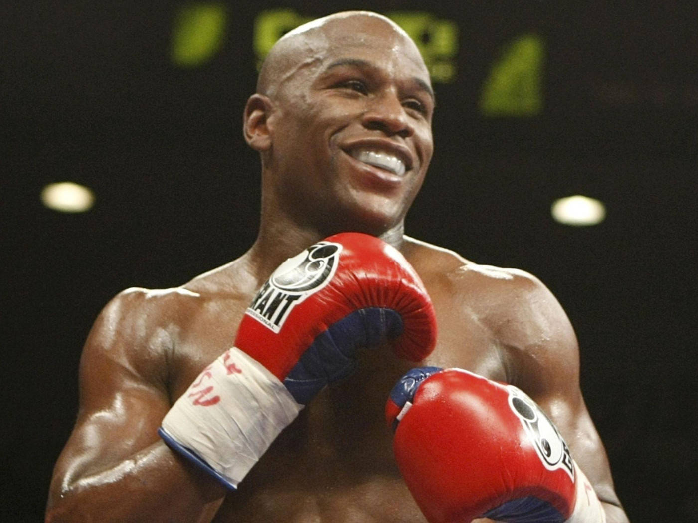 Floyd Mayweather Smiling Red Boxing Gloves Background