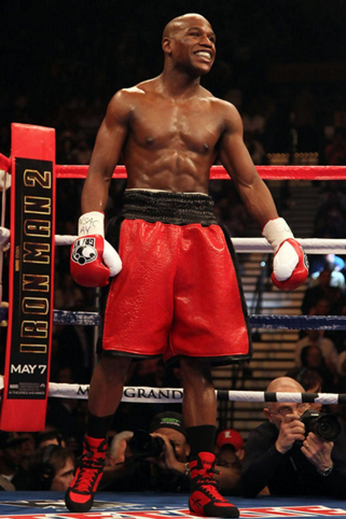 Floyd Mayweather Standing Tall In Ring Background