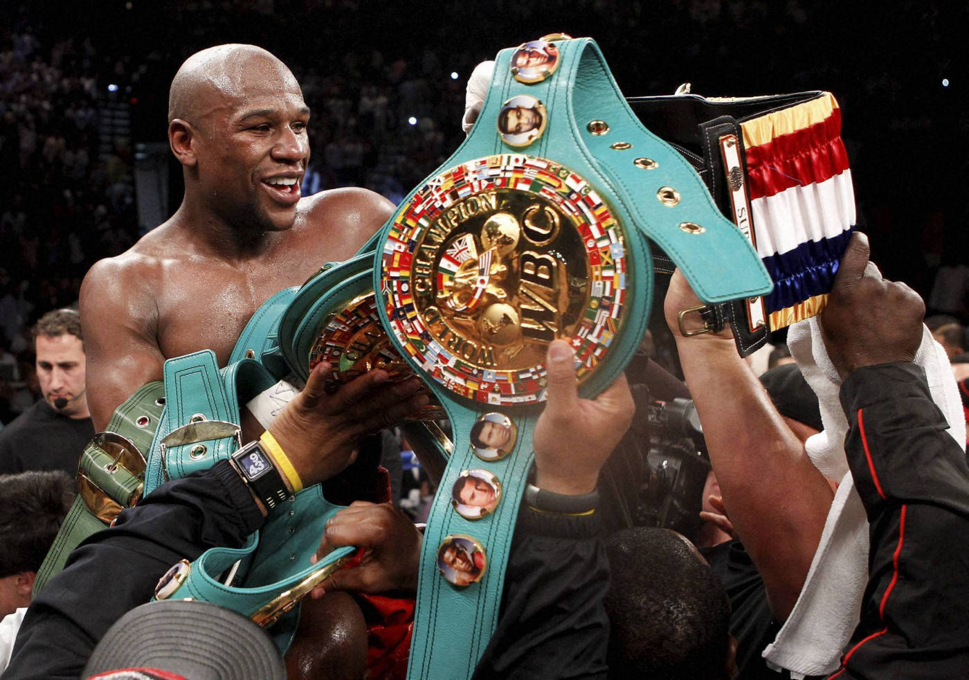 Floyd Mayweather With Multiple Champion Belts Background